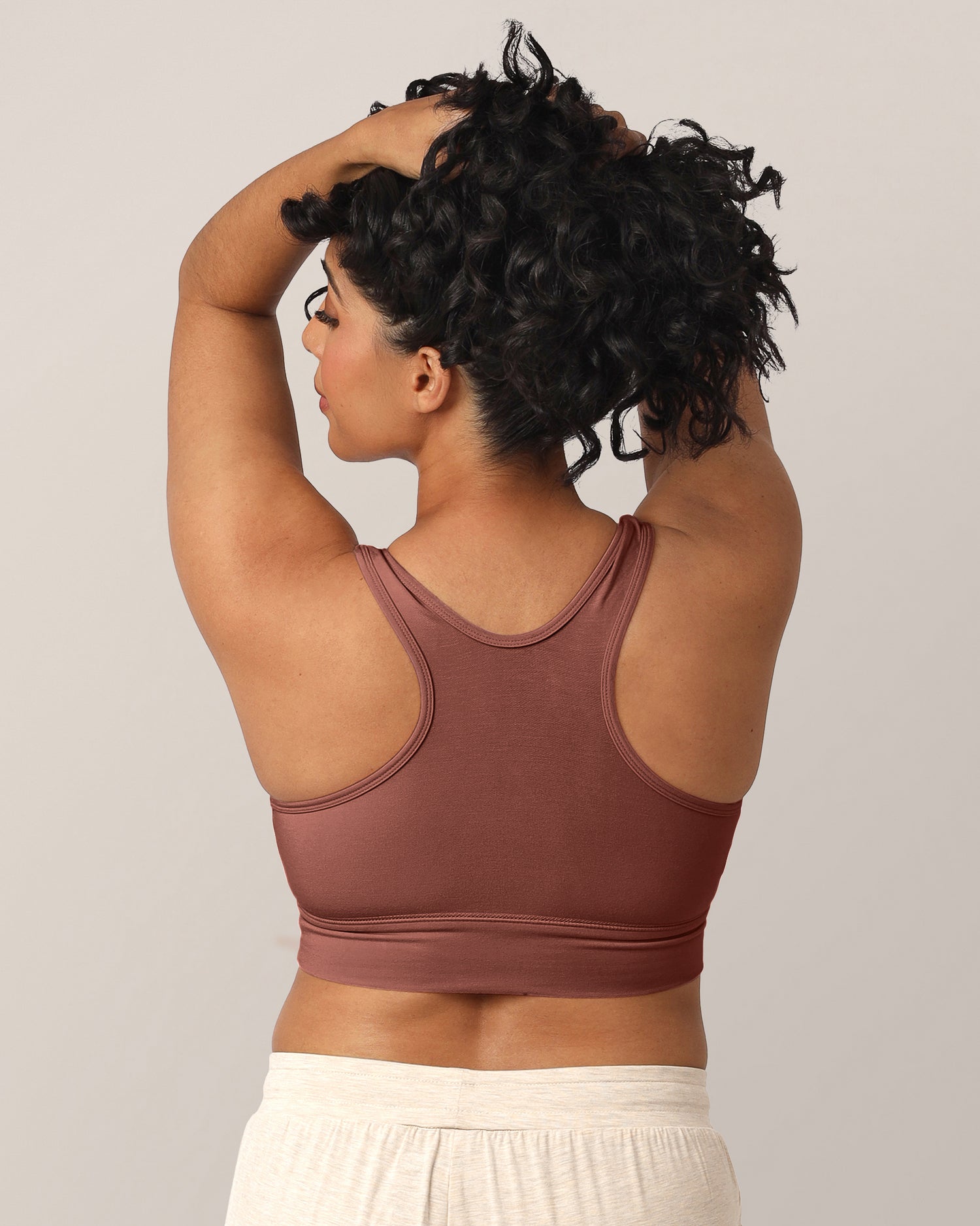 Back view of a model wearing the French Terry Racerback Nursing & Sleep Bra in Redwood