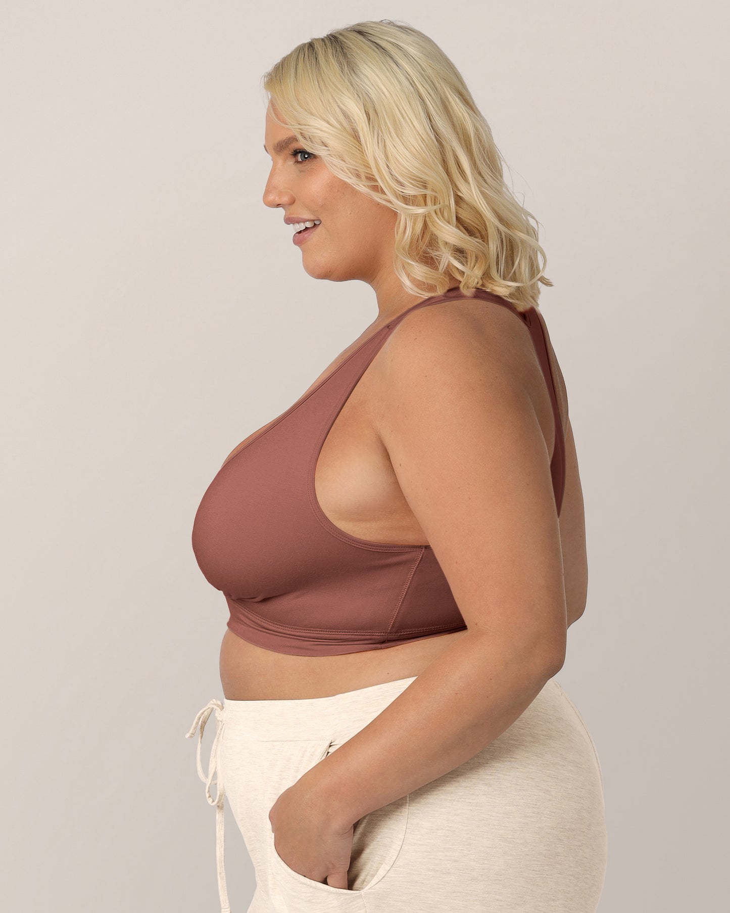 Side view of the model wearing the French Terry Racerback Nursing & Sleep Bra. 