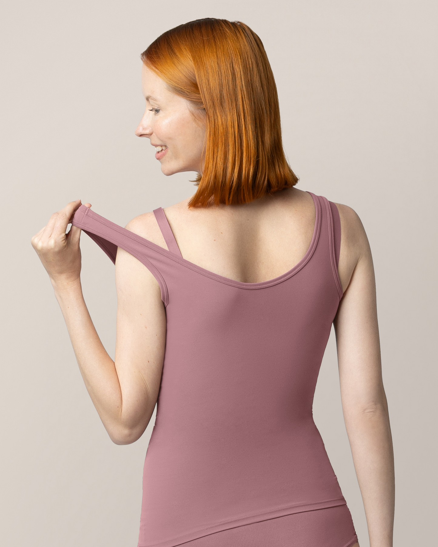 Back view of model wearing the Grow with Me™ Maternity & Nursing Tank in Twilight, showing stretch