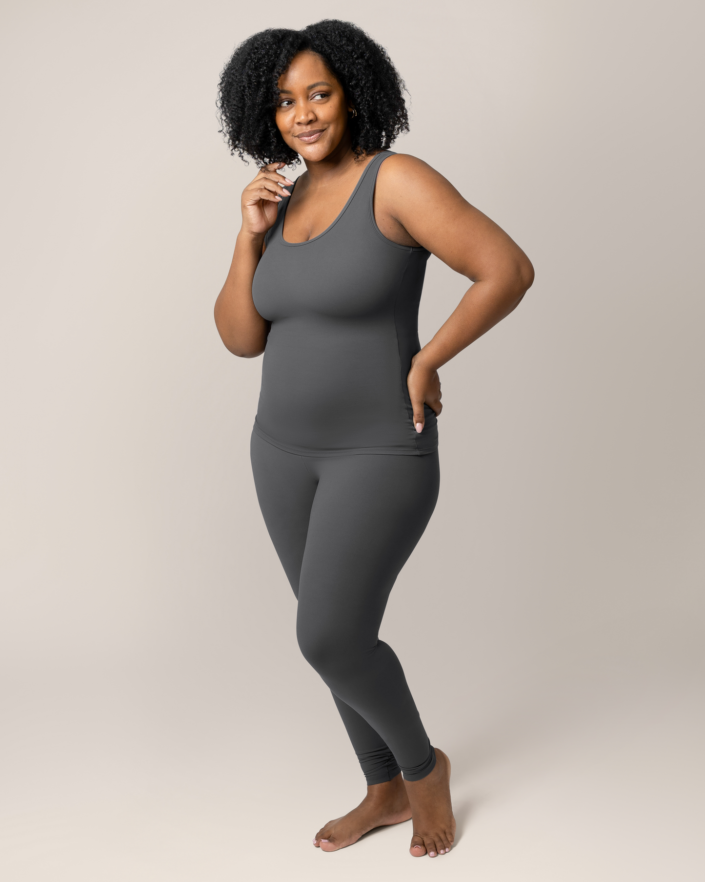 Model wearing the Grow with Me™ Maternity & Postpartum Legging in Stormy Grey paired with matching Grow with Me™ Maternity & Nursing Tank @model_info:Roxanne is 5'8" and wearing a Large.