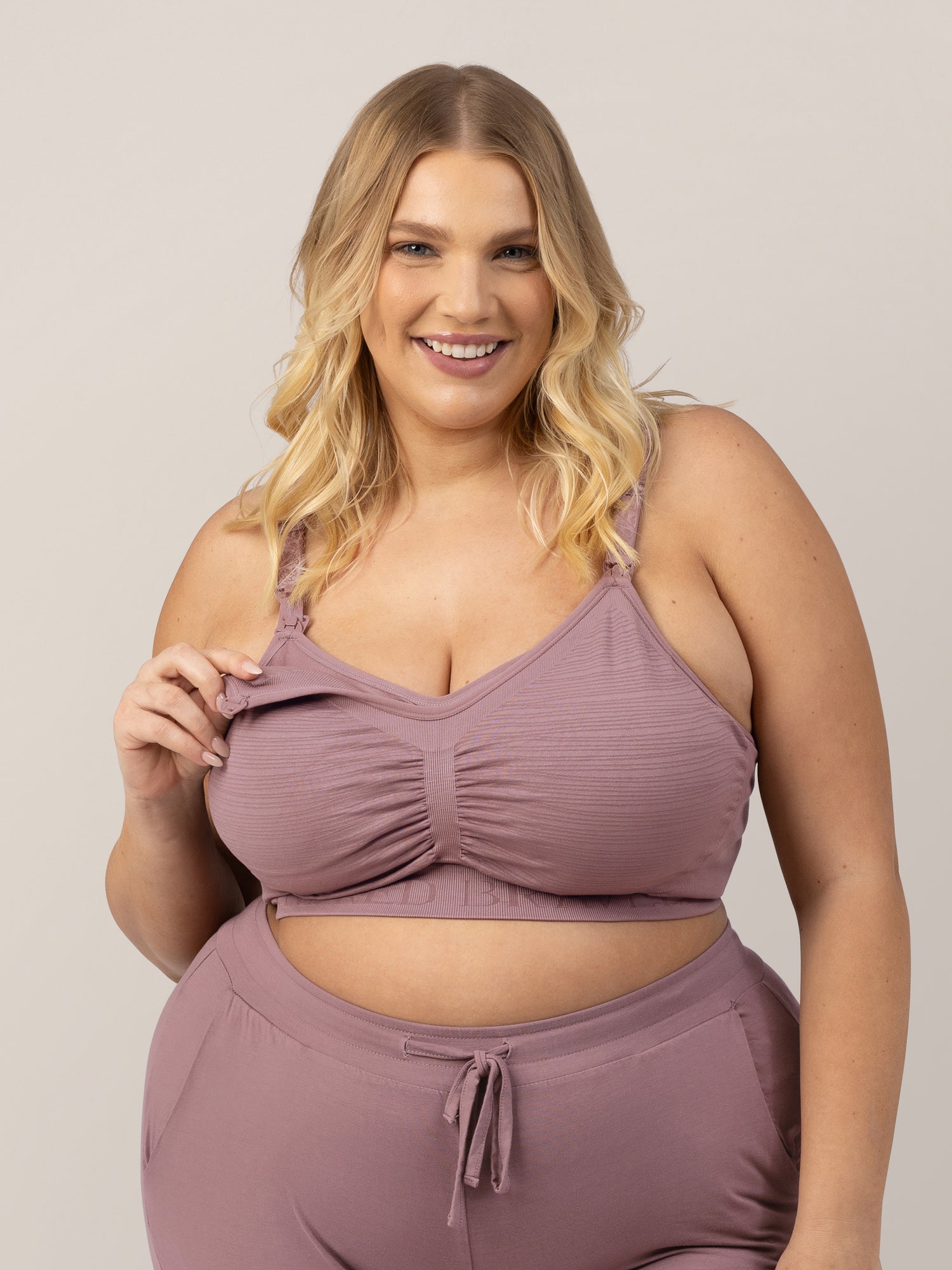 Model showing the clip down pumping access on the Sublime® Hands-Free Pumping & Nursing Bra in Twilight @model_info:Lauren is wearing an X-Large Busty.