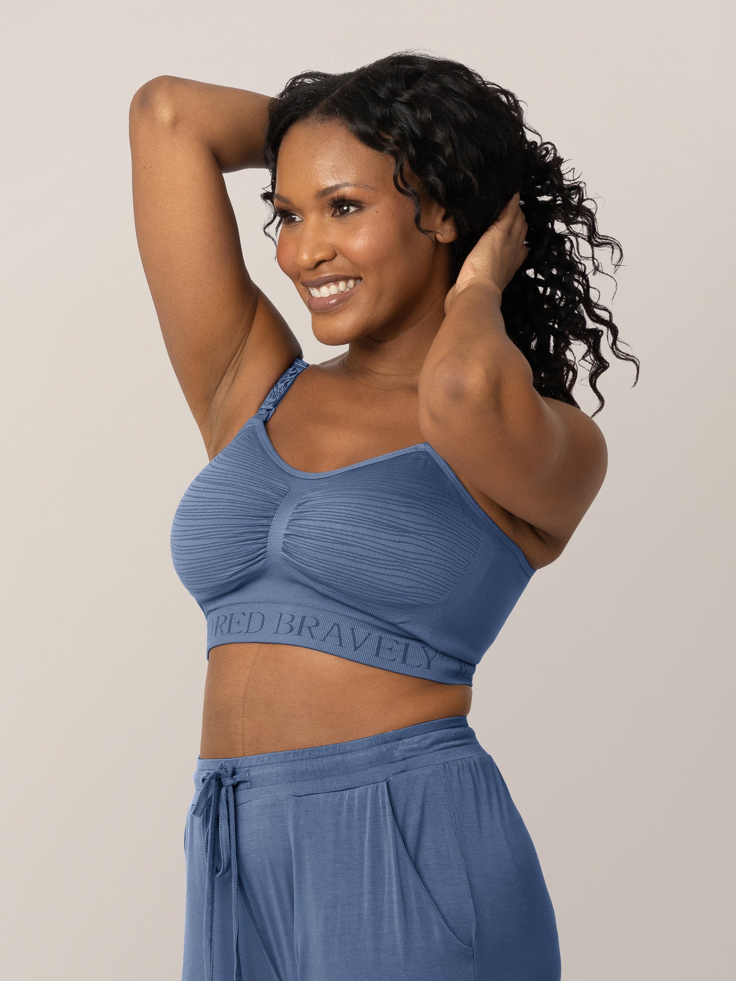 3/4 front view of model wearing the Sublime® Hands-Free Pumping & Nursing Bra in Slate Blue