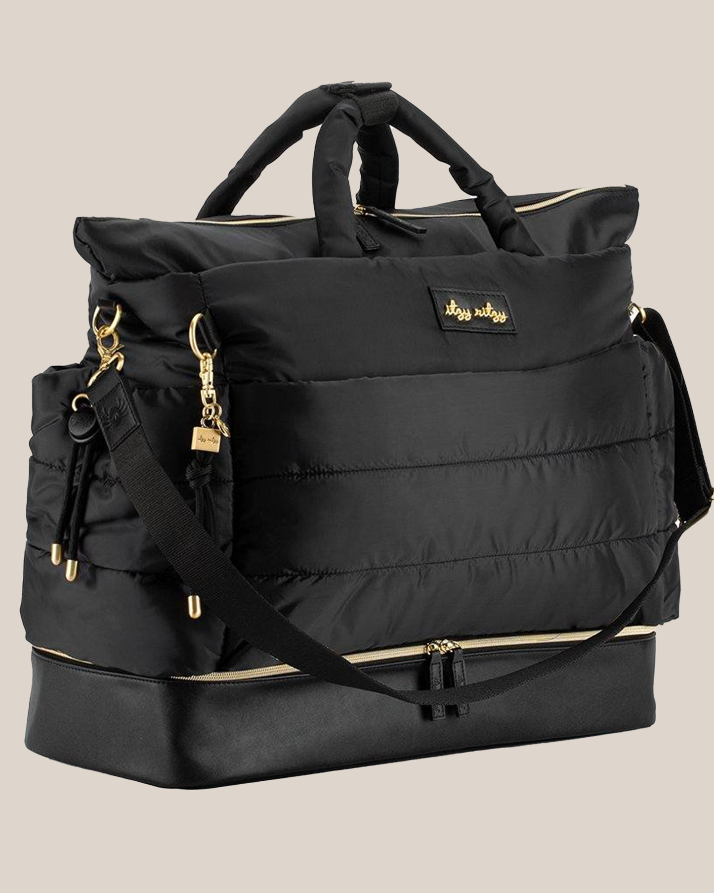 3/4 view of the Itzy Ritzy - Dream Weekender™ Hospital & Travel Bag in Midnight Black, showing shoulder strap