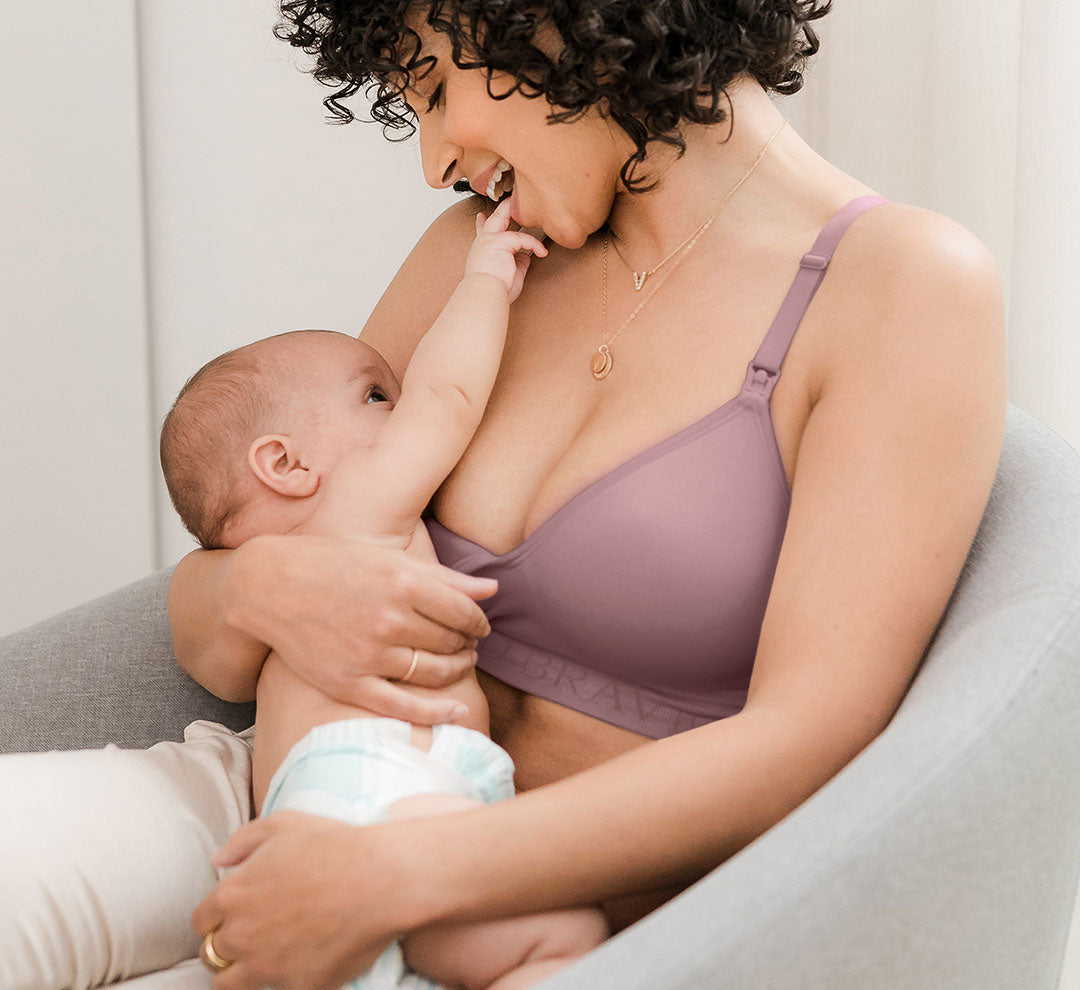 Model wearing the Signature Sublime® Contour Maternity & Nursing Bra in Twilight and nursing baby