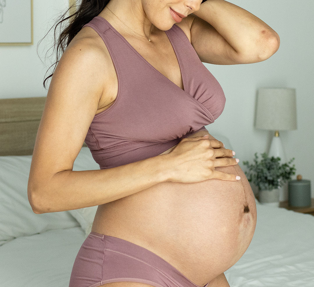 Pregnant model wearing the French Terry Racerback Nursing & Sleep Bra in Twilight, paired with matching Grow With me Underwear