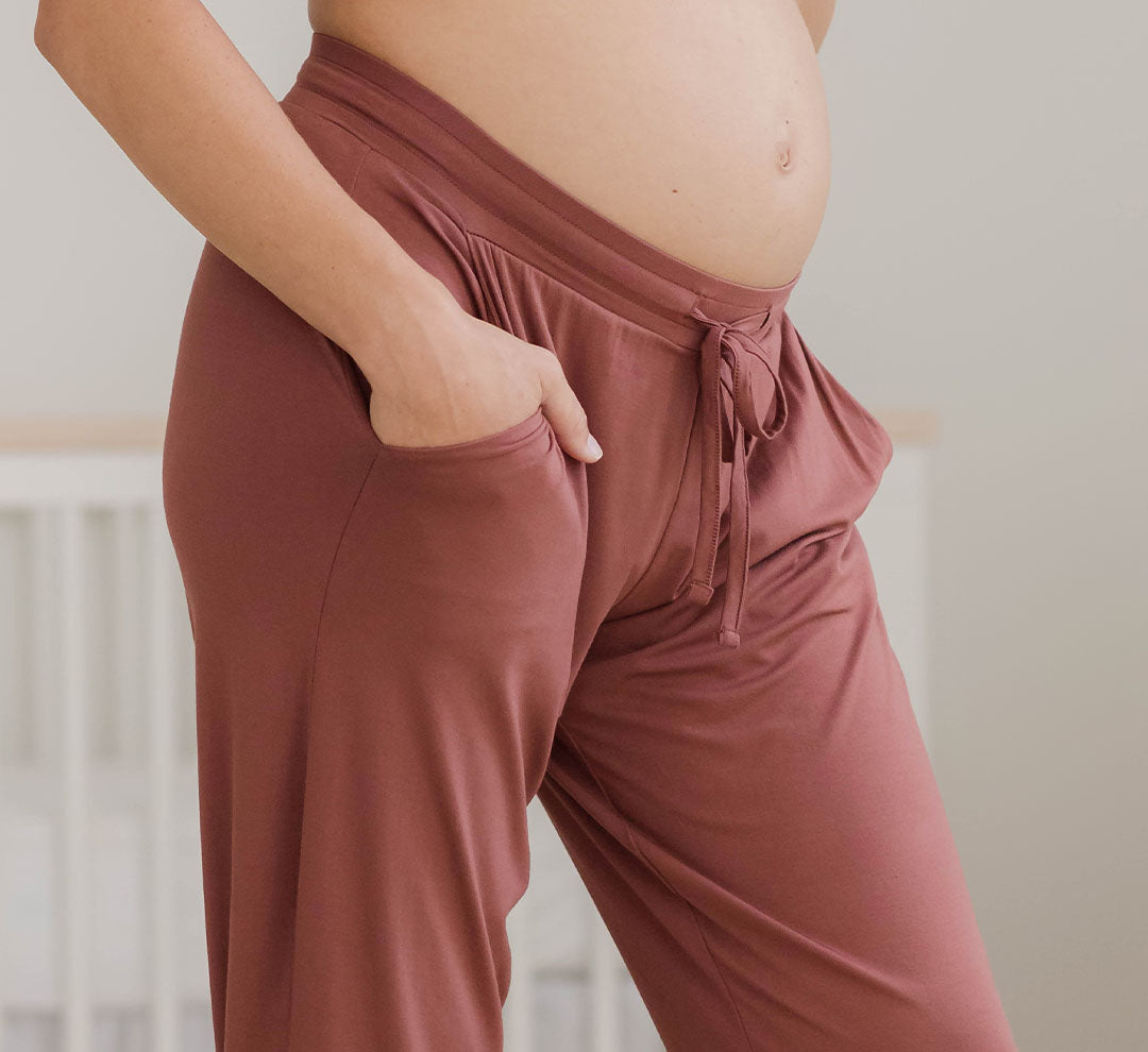 Detail shot of the Everyday Lounge Jogger in Redwood on model, highlighting pocket and drawstring