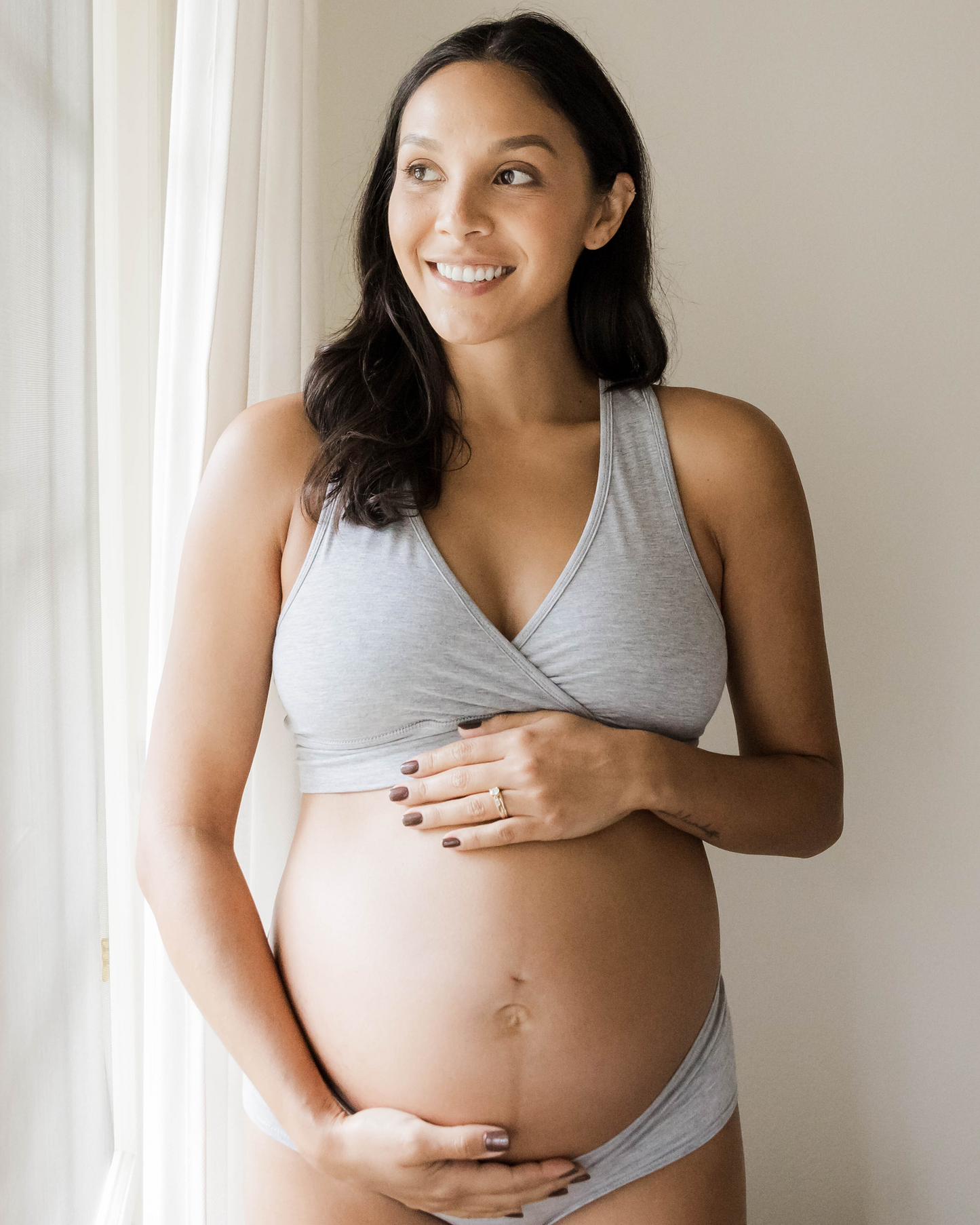 Pregnant model wearing the French Terry Racerback Nursing Bra in Grey Heather