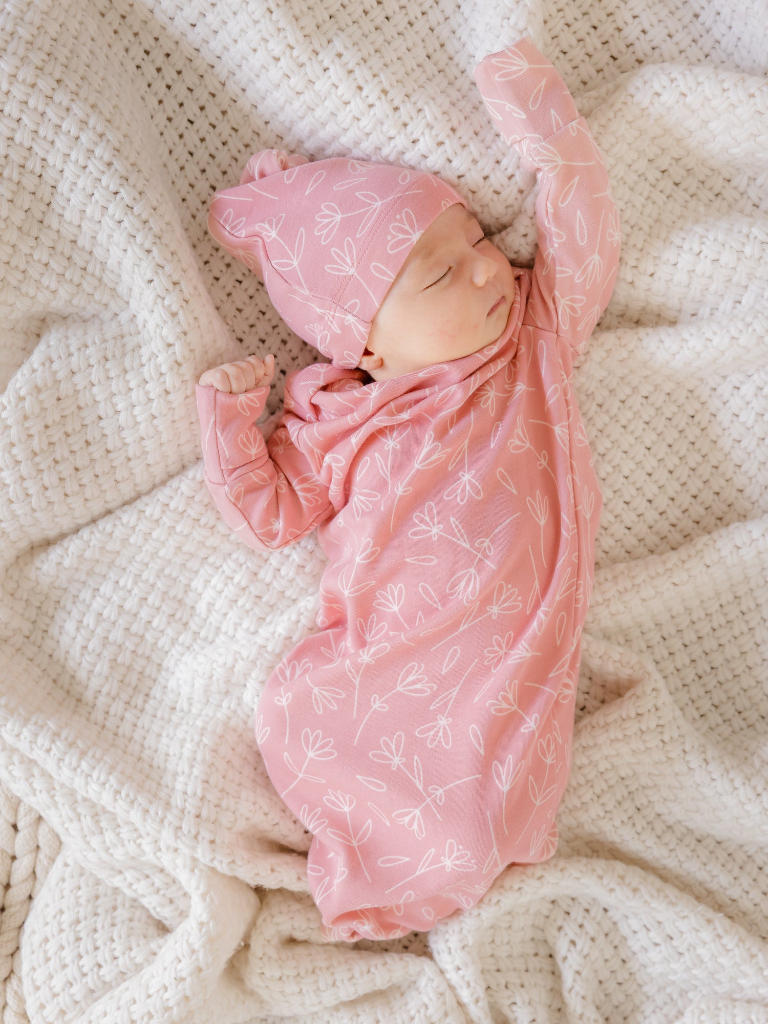 Newborn wearing the Baby Knotted Gown & Hat Set in Pink Floral.