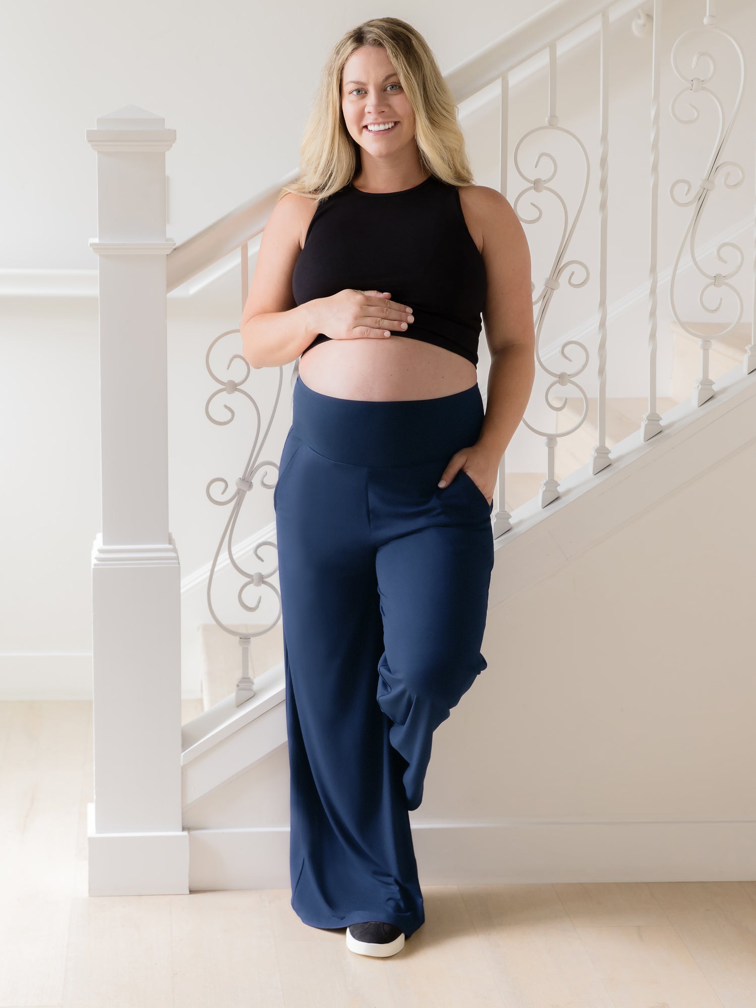 Front view of model wearing the Bamboo Wide Leg Maternity & Postpartum Lounge Pant in Navy, paired with the Sublime Bamboo Longline Bra in Black @model_info:Erin is wearing a Medium.