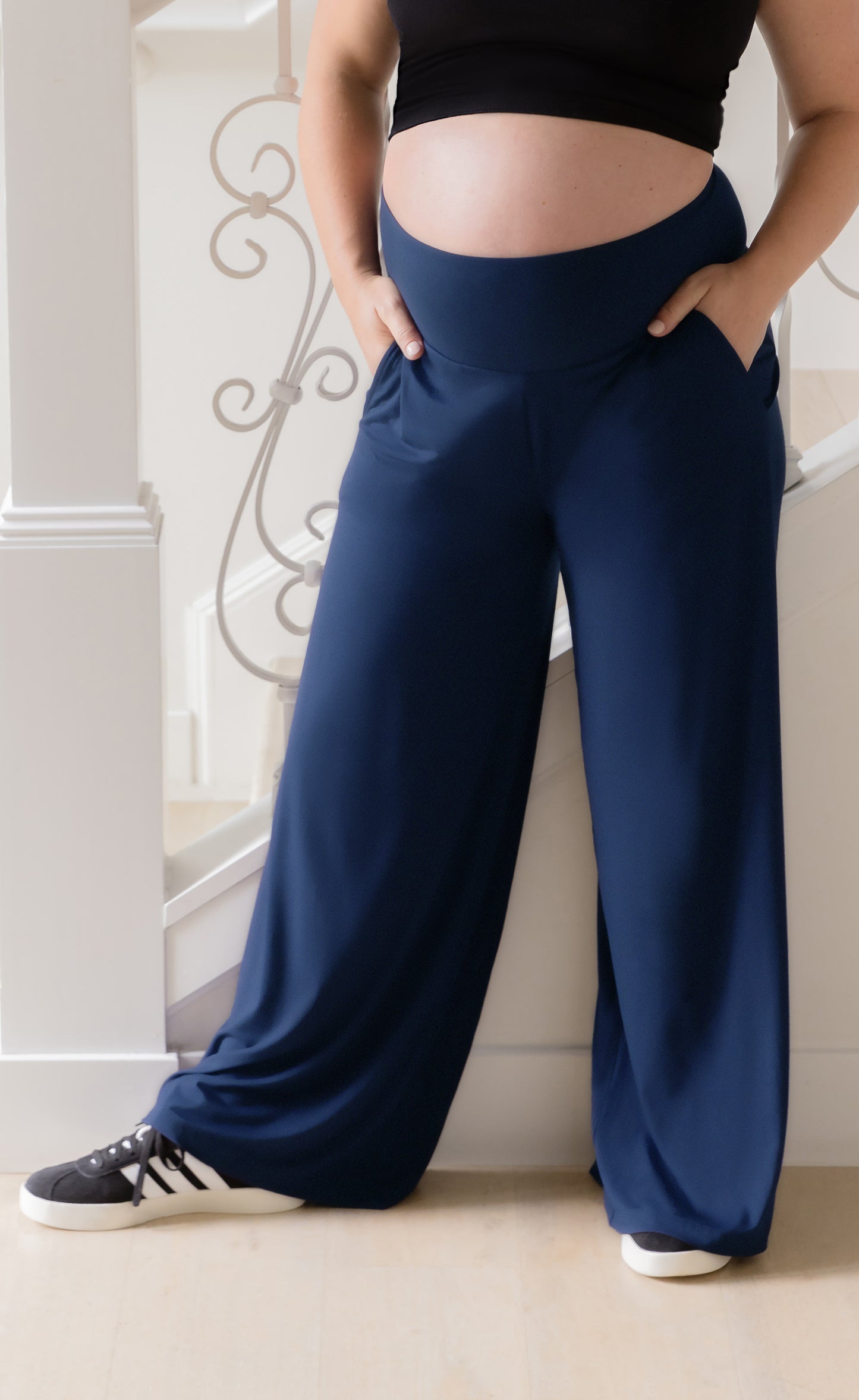 Close up of front of the Bamboo Wide Leg Maternity & Postpartum Lounge Pant in Navy, on model with her hands in the pockets