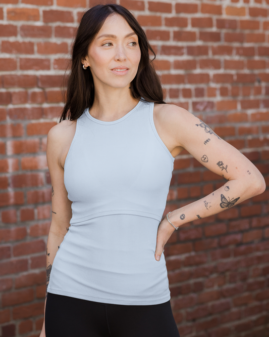 Model outside wearing the Ribbed Bamboo Racerback Nursing Tank in French Blue@model_info:Lyn is wearing a Small.