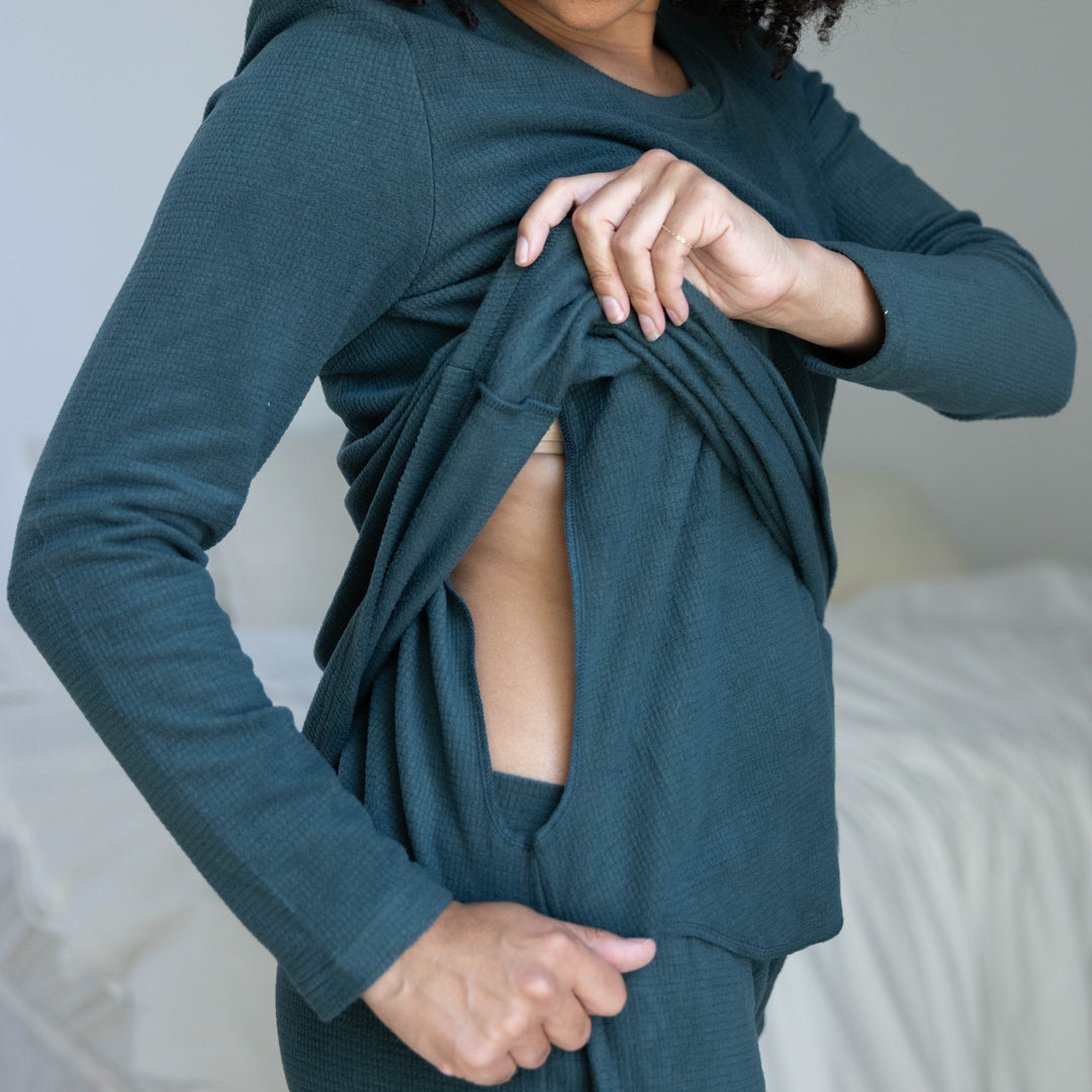 Closeup of a model wearing the Fleece Nursing & Maternity Pajama Set in Evergreen showing the nursing panel.