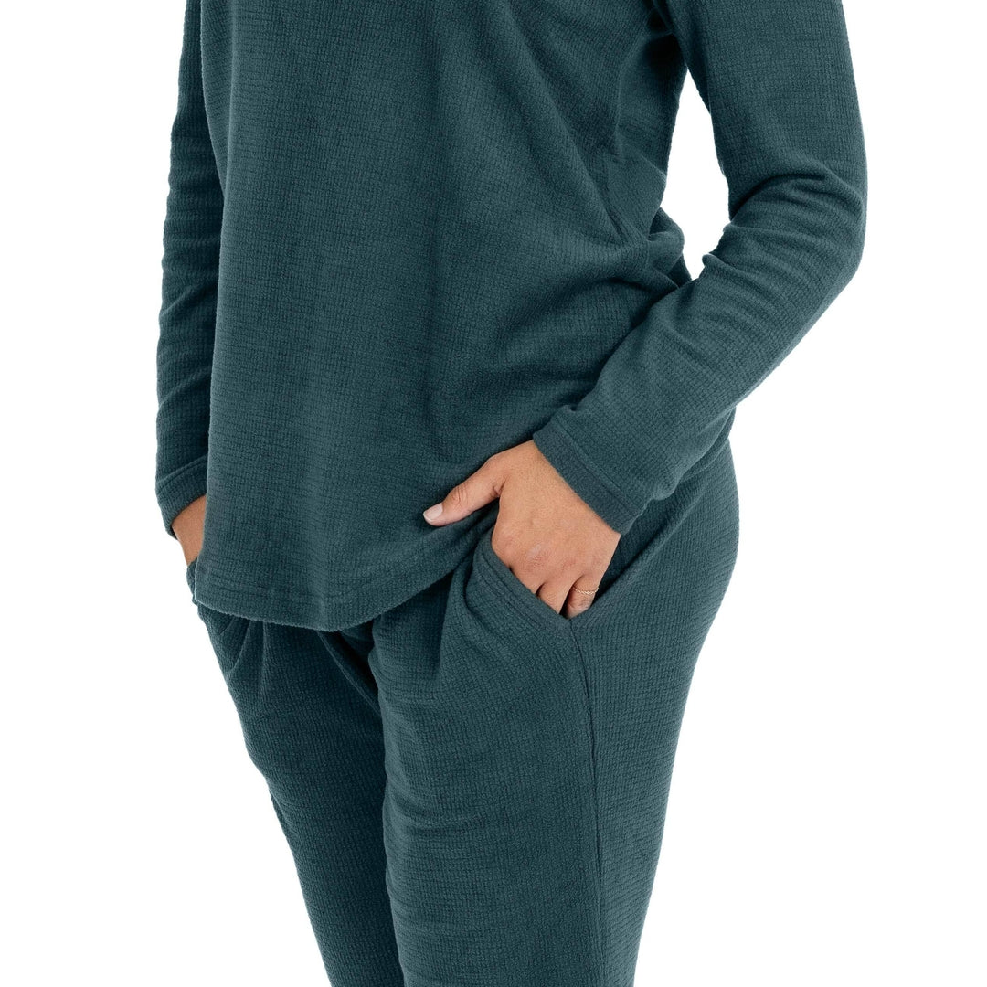 Closeup of a model wearing the Fleece Nursing & Maternity Pajama Set in Evergreen .