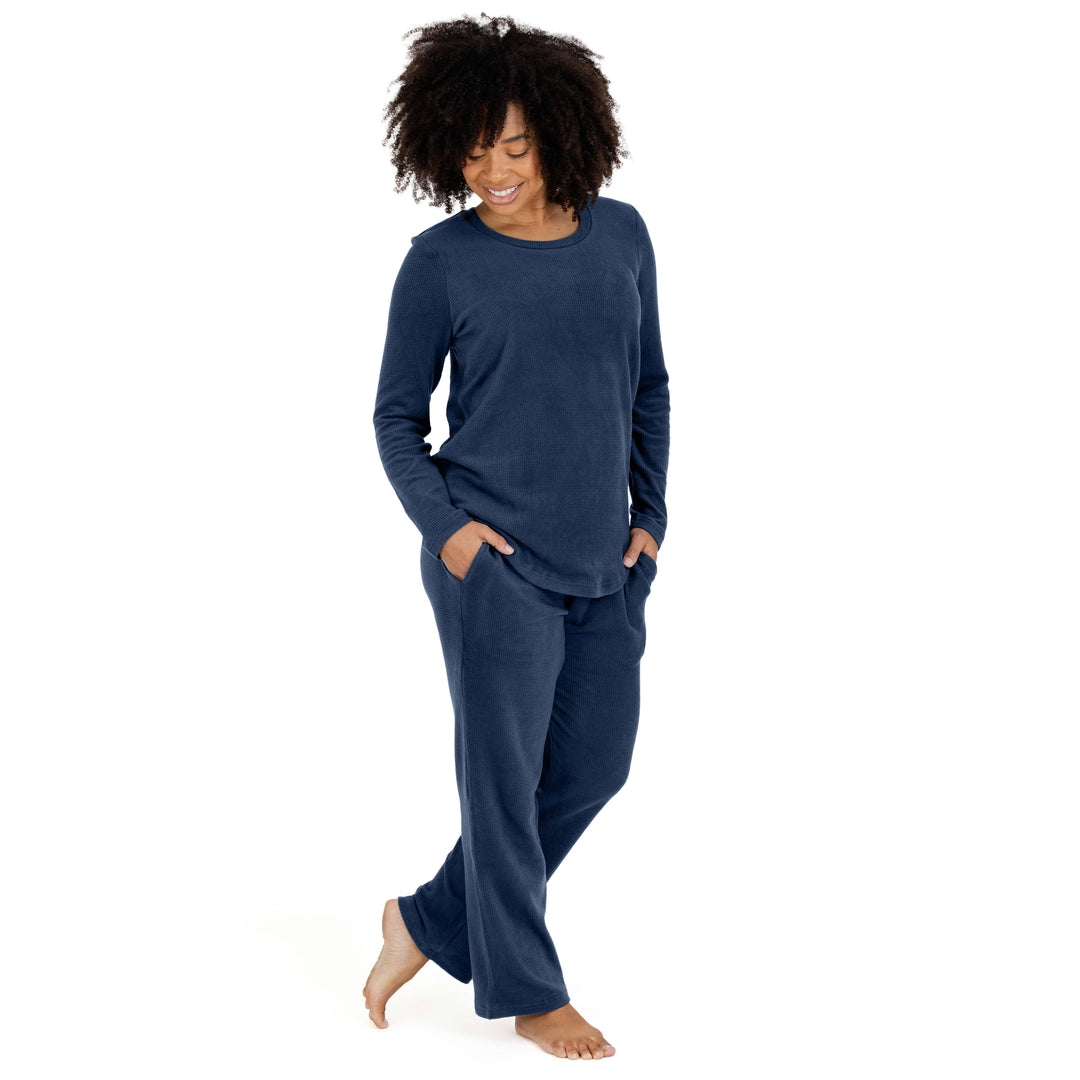 Model looking down at the ground with her hands in the pockets of her Fleece Nursing & Maternity Pajama Set