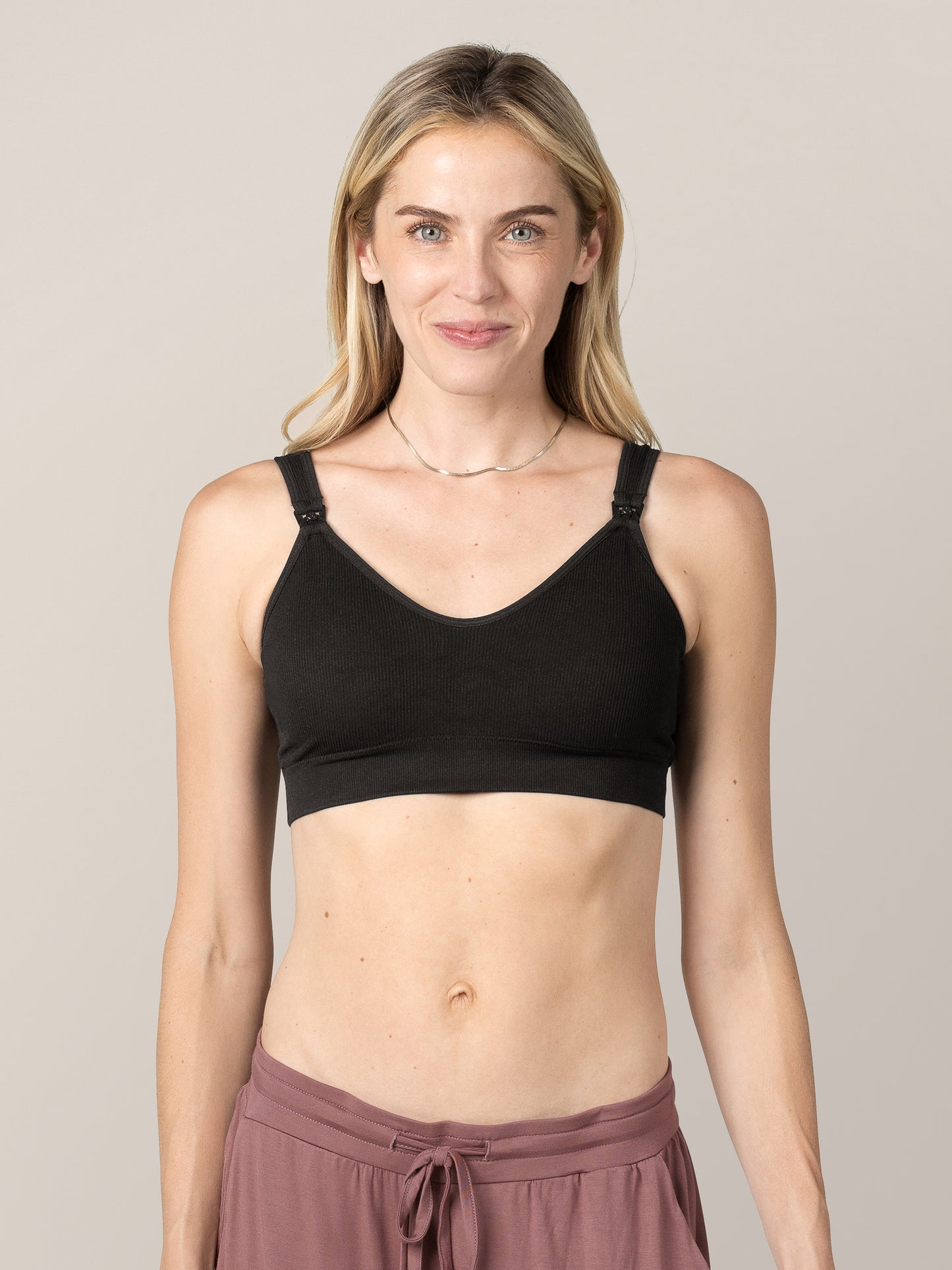 Model wearing the Mia Maternity & Nursing Lounge Bra in Black. @model_info:Mia is wearing a Small.