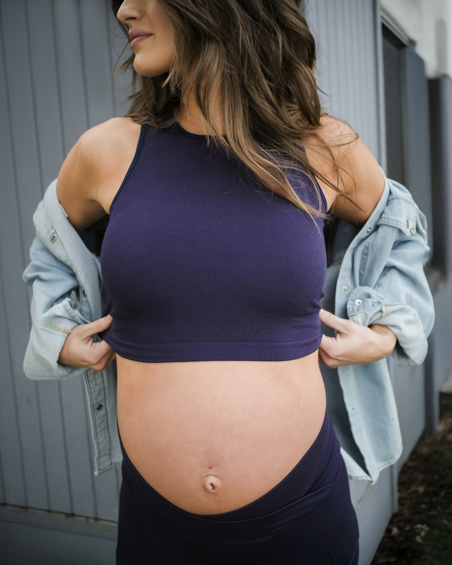 Close-up of model wearing the Sublime® Bamboo Maternity & Nursing Longline Bra Top in Navy, paired with matching leggings and open slouched button down top @model_info:Andrea is wearing a Small.