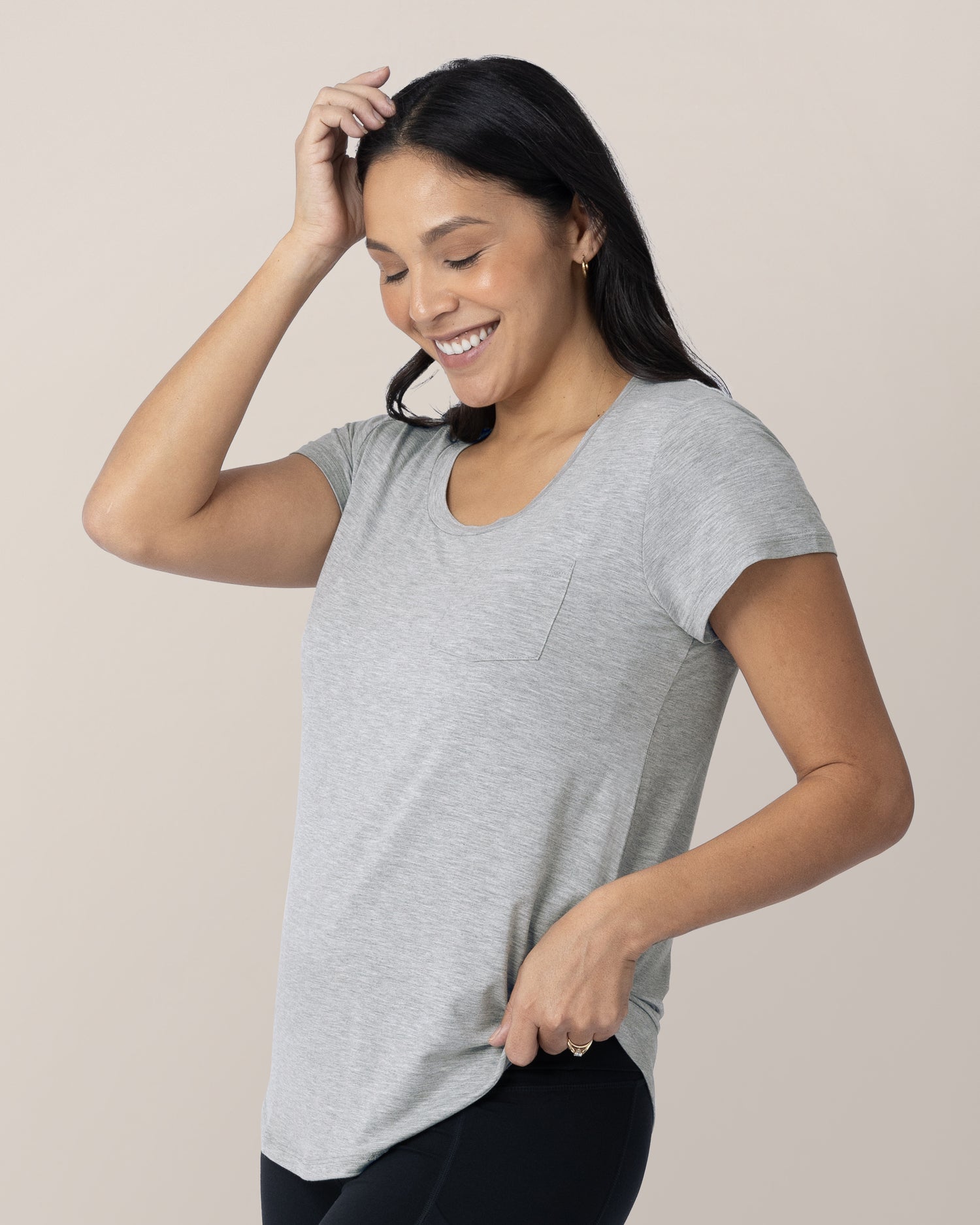 Model wearing the Everyday Maternity & Nursing T-shirt in Grey Heather with her hand on her head and hip.  @model_info:Julana is wearing a Small.