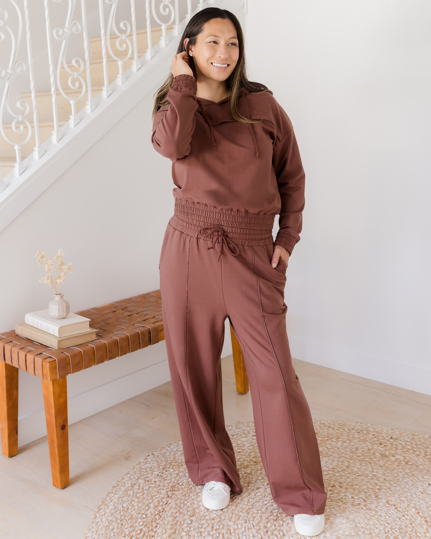 Full body image of model wearing the Mila High-Waisted Wide Leg Pant in Redwood with matching Mila Cropped Nursing Hoodie. @model_info:Joy is 5'7" and wearing a Medium Regular.