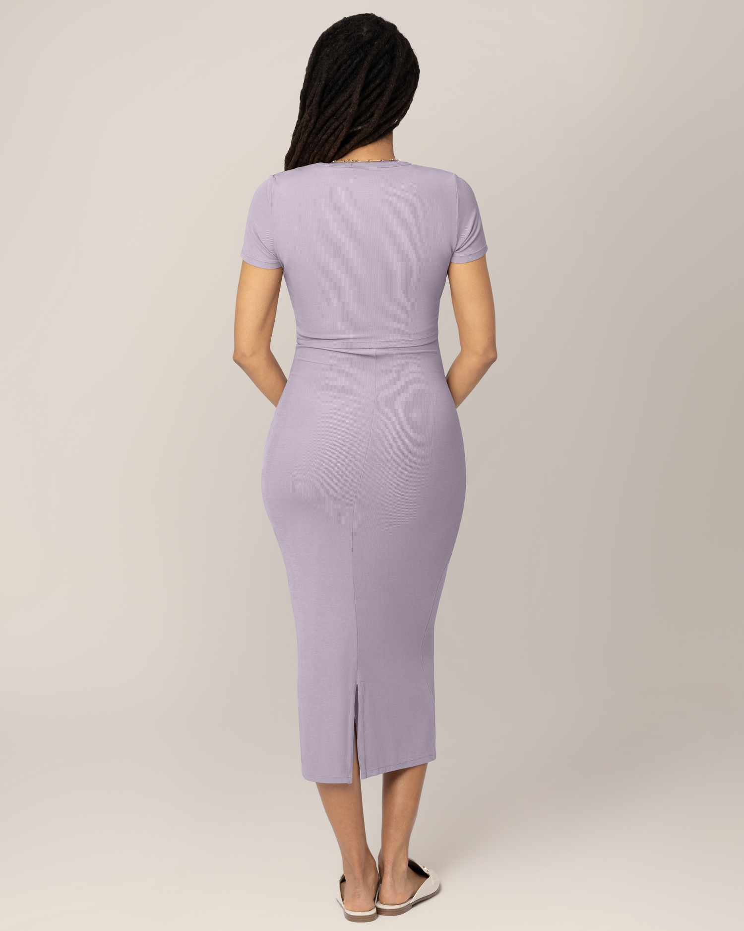 Back view of model wearing the Olivia Ribbed Bamboo 2-in-1 Maternity & Nursing Dress in Lavender Mist