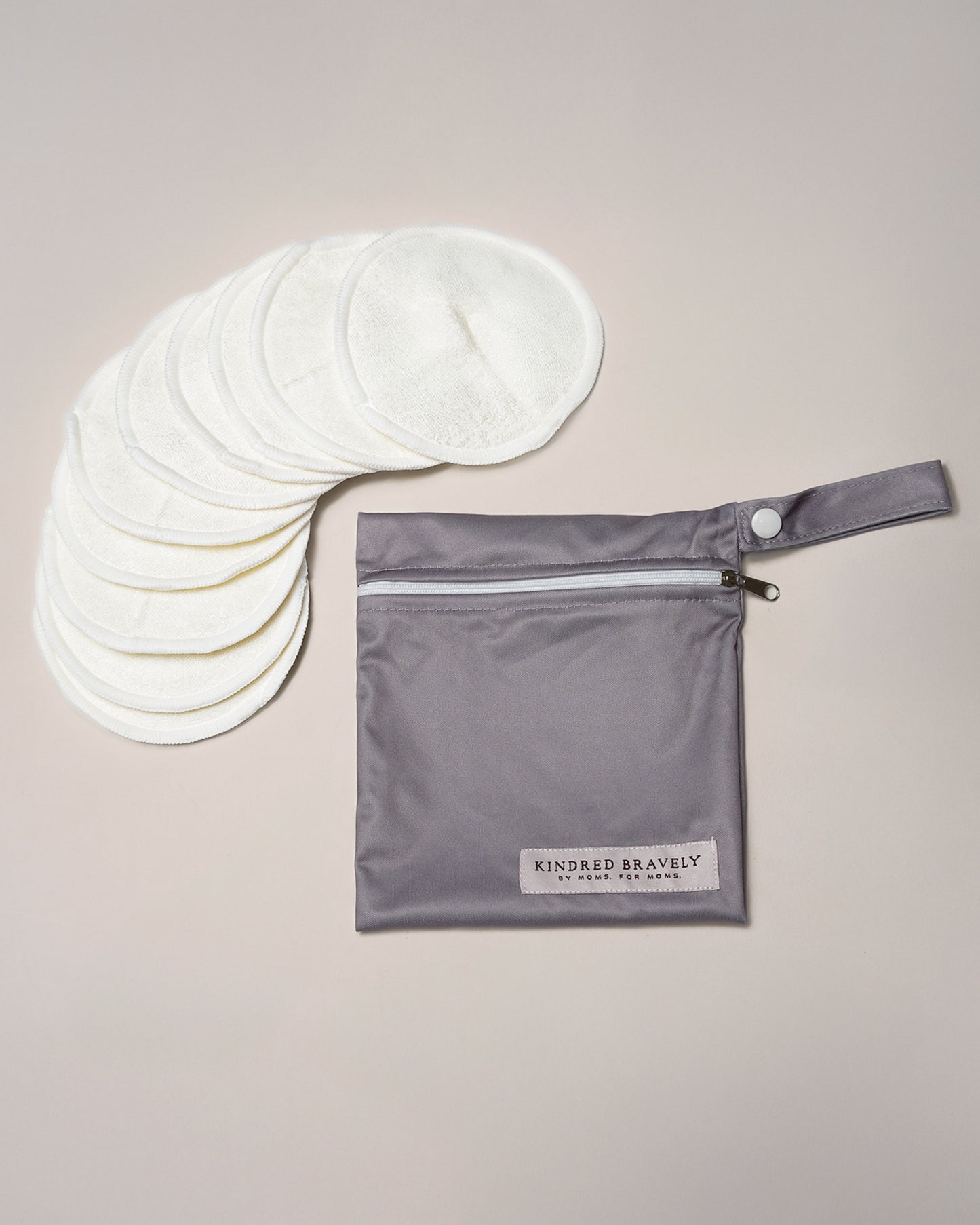 Flat lay of the Organic Bamboo Reusable Nursing Pads against an off white background. 