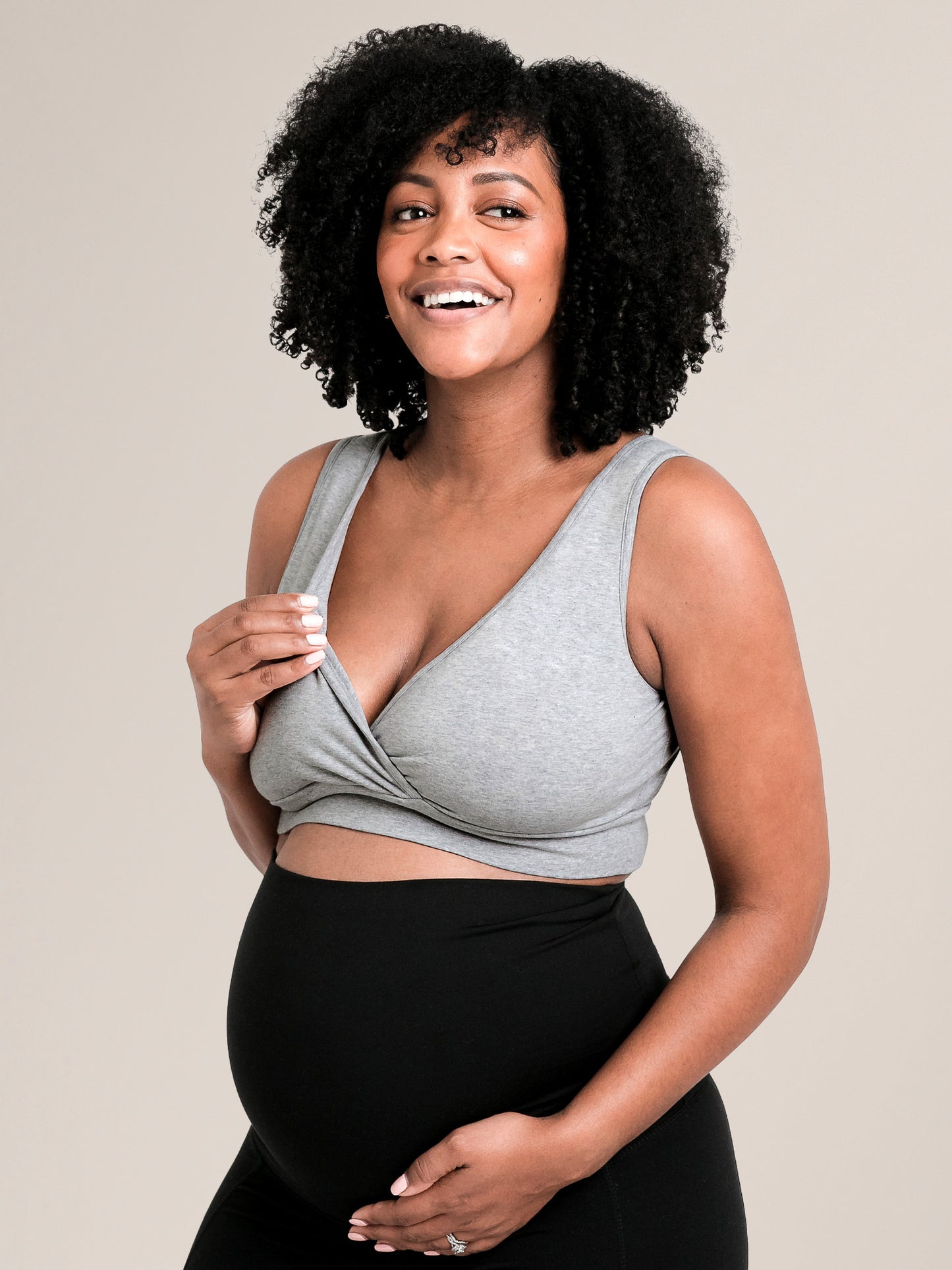 Model wearing the Organic Cotton Sleep & Nursing Bra in Grey Heather, showing nursing access.