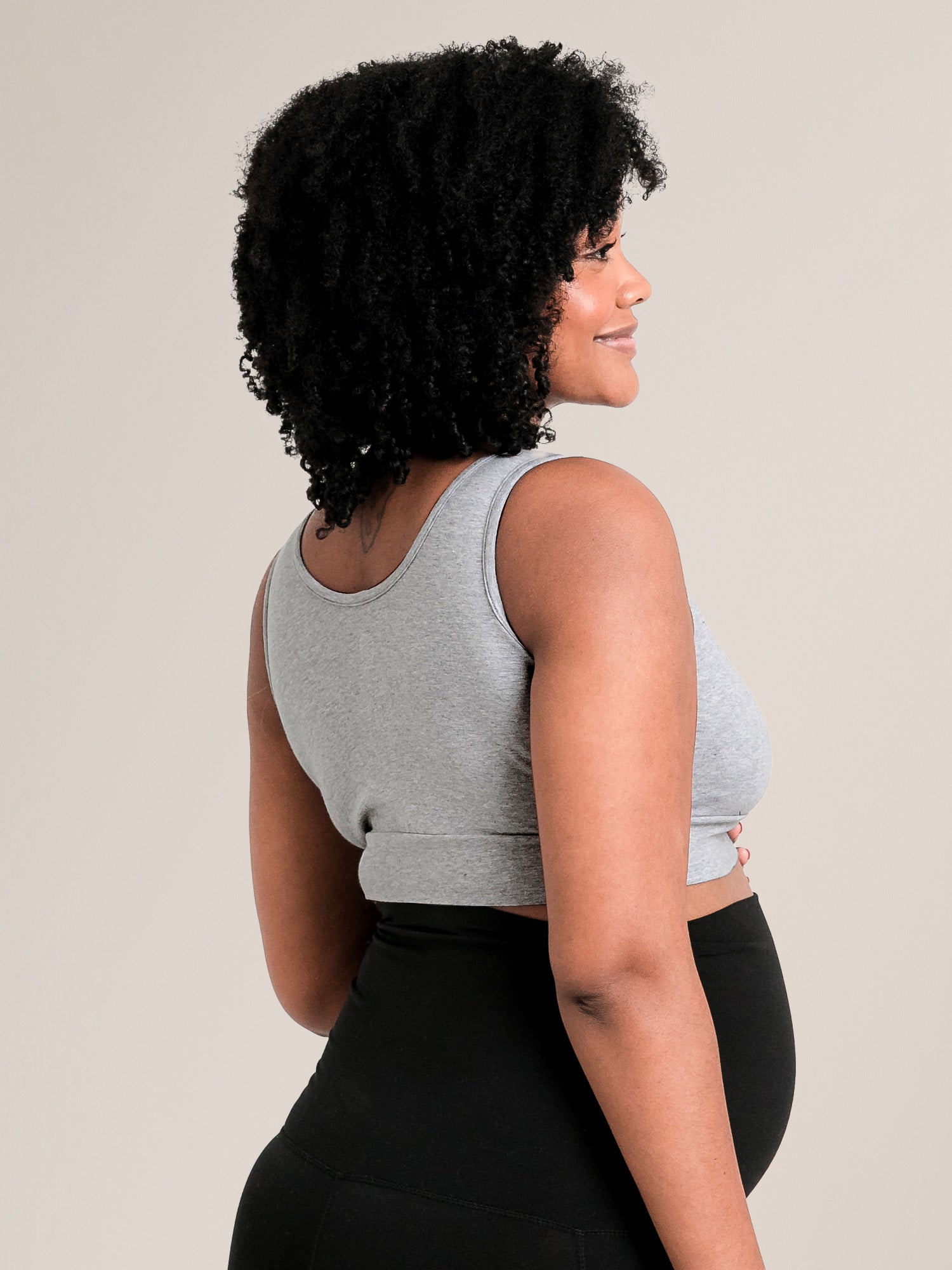 Side back view of model wearing the Organic Cotton Sleep & Nursing Bra in Grey Heather 