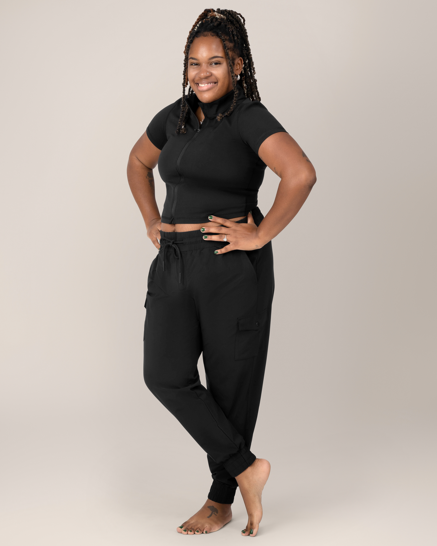 Front view of Model wearing the Remy Maternity & Postpartum Cargo Jogger in Black with matching Presley Active Zip Front Nursing Top @model_info:Tonia is 5'7" and wearing an X-Large.