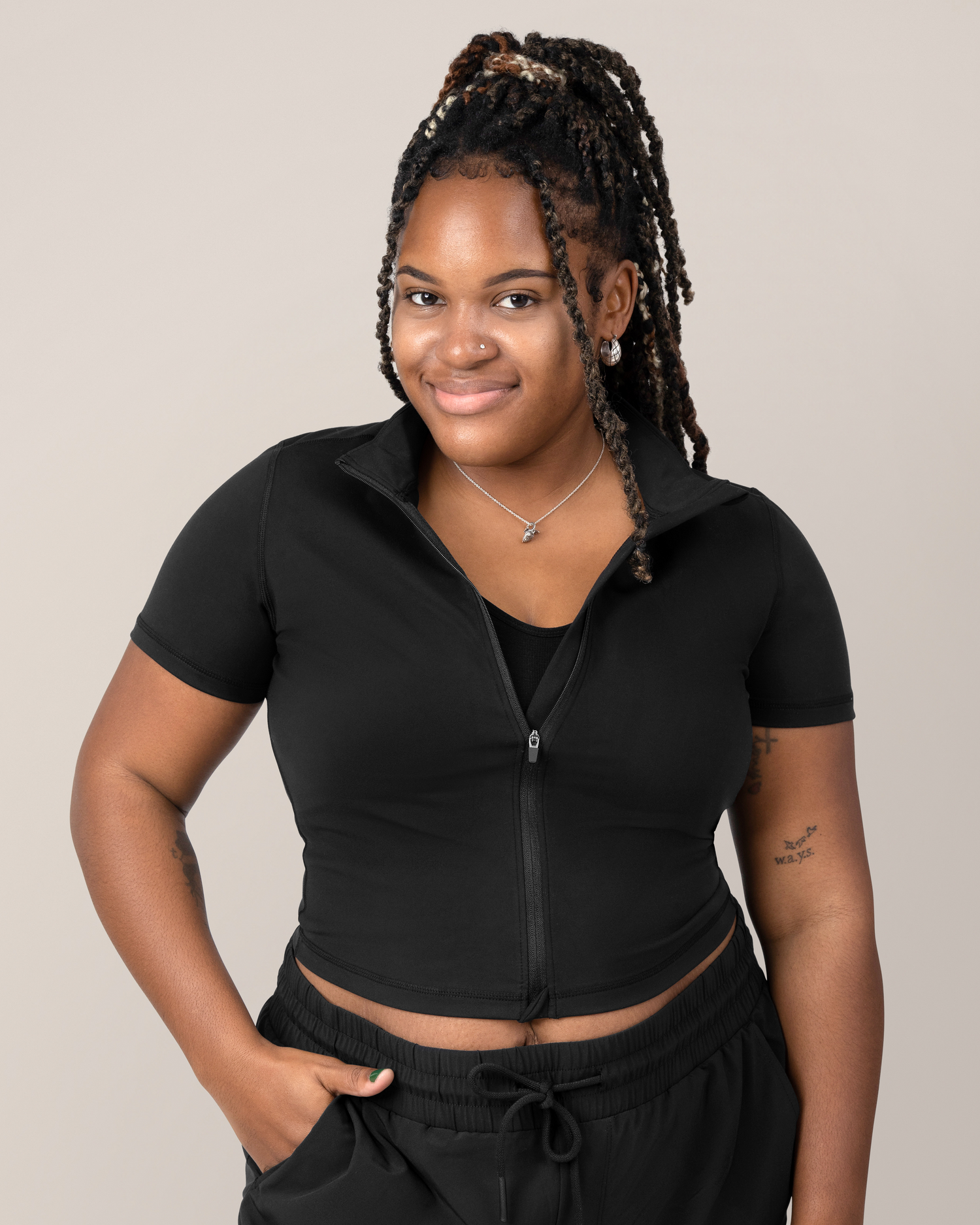 Front view of Model wearing the Presley Active Zip Front Nursing Top in Black