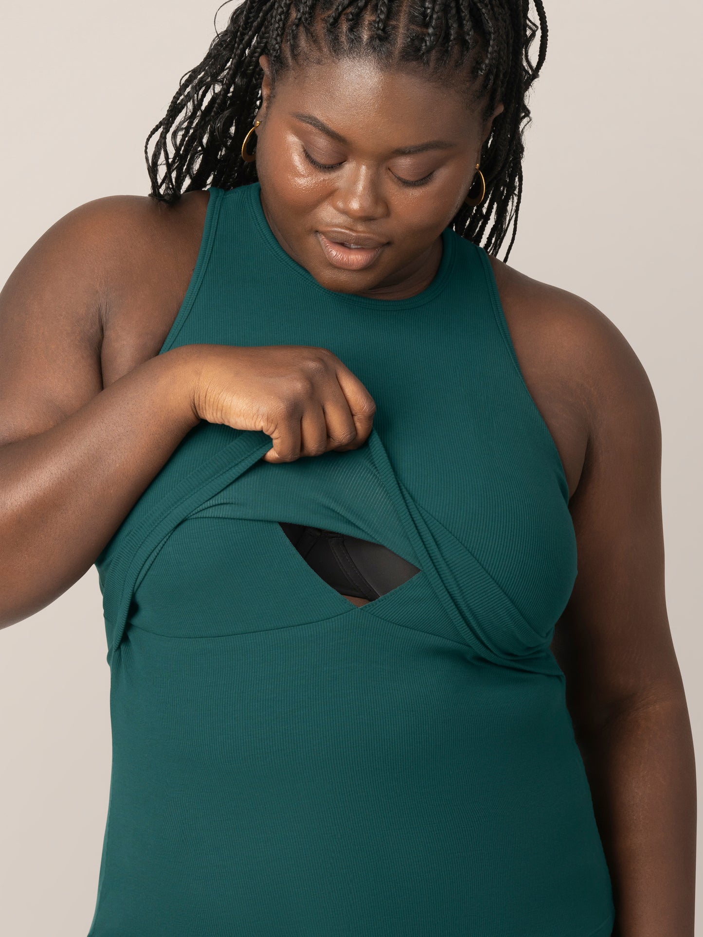 Front cropped in view of model wearing the Ribbed Bamboo Racerback Nursing Tank in evergreen, showing nursing access