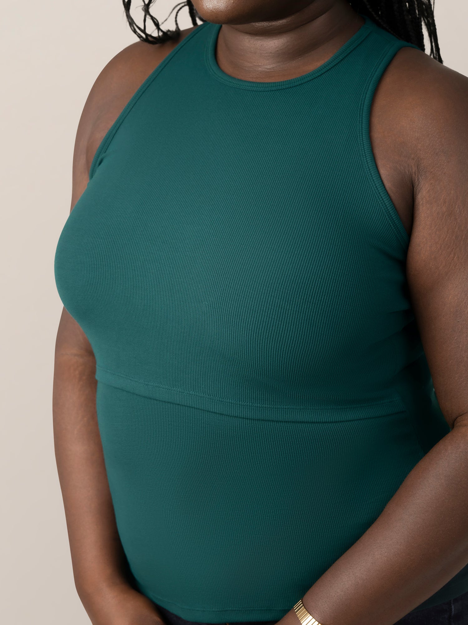 Front 3/4 cropped in view of model wearing the Ribbed Bamboo Racerback Nursing Tank in evergreen, showing ribbed detail and neckline