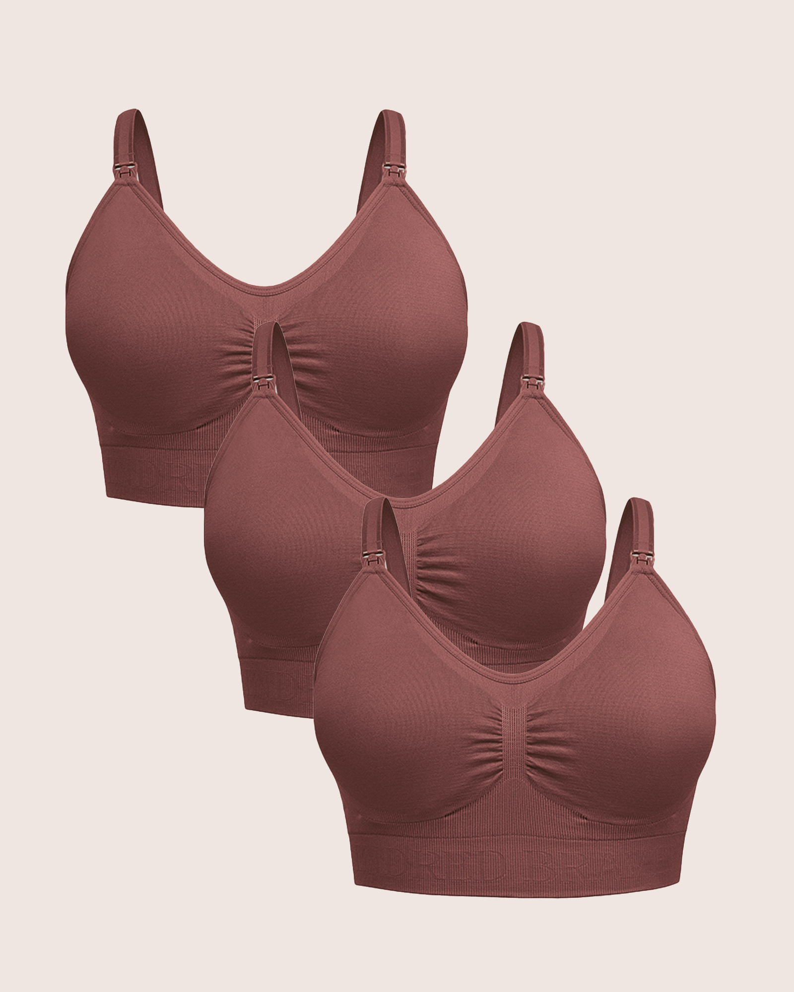 A Wash Wear Spare® Nursing Bra Pack | Redwood showing three Simply Sublime® Nursing Bras in redwood against a beige background