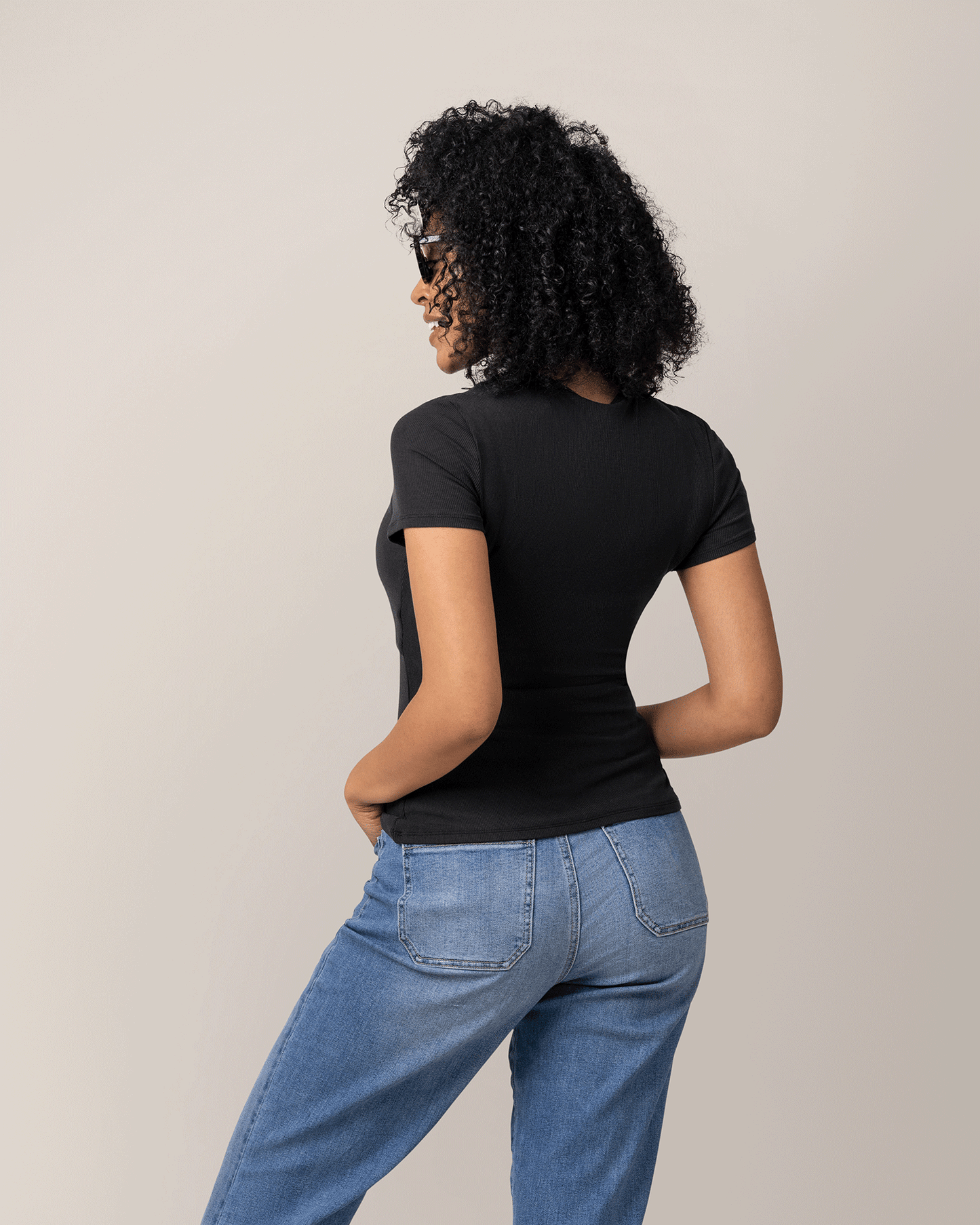 Back view of model wearing Ribbed Bamboo Crew Neck Nursing T-shirt in Black