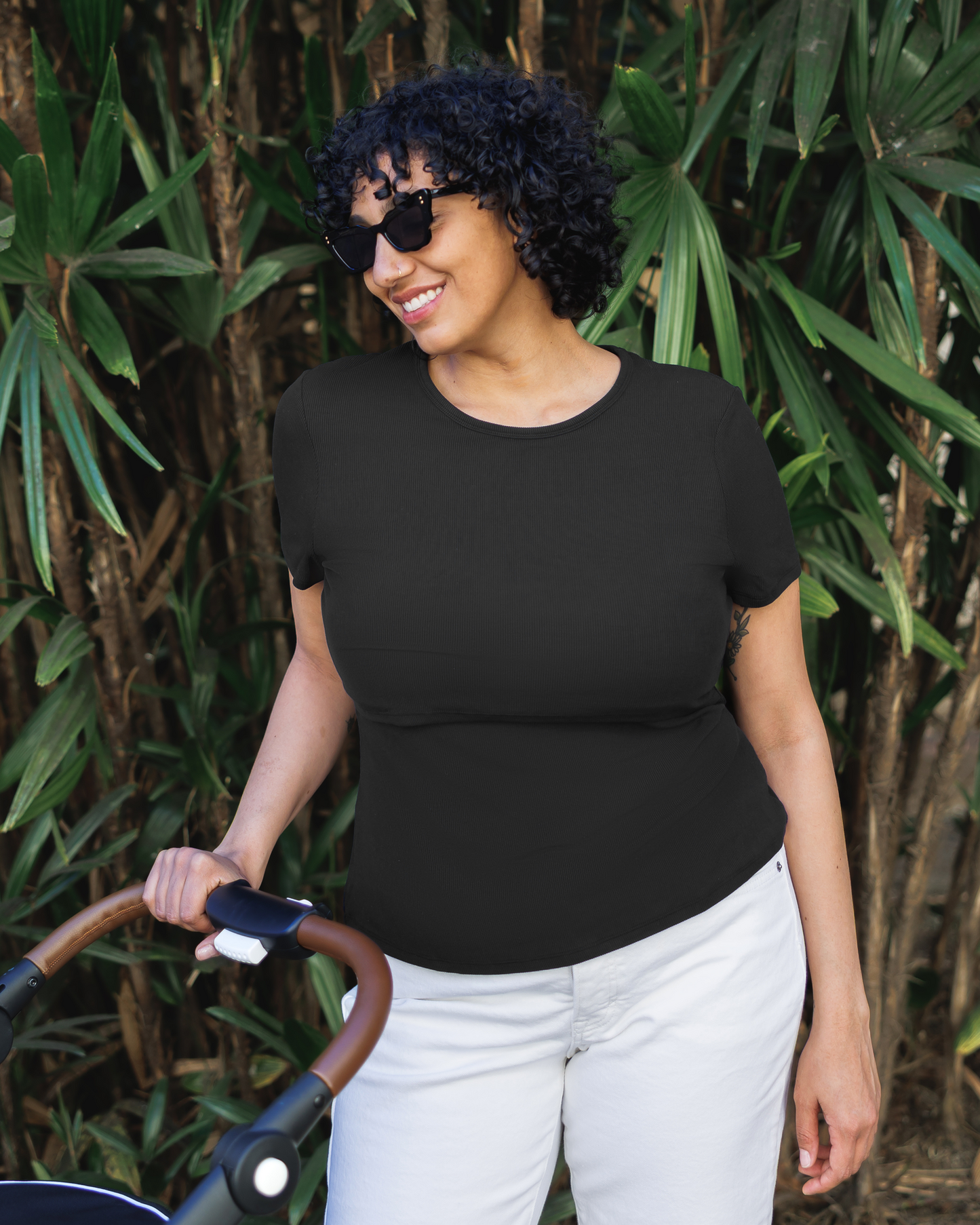 Model pushing stroller and wearing Ribbed Bamboo Crew Neck Nursing T-shirt in Black @model_info:Indira is wearing an X-Large.