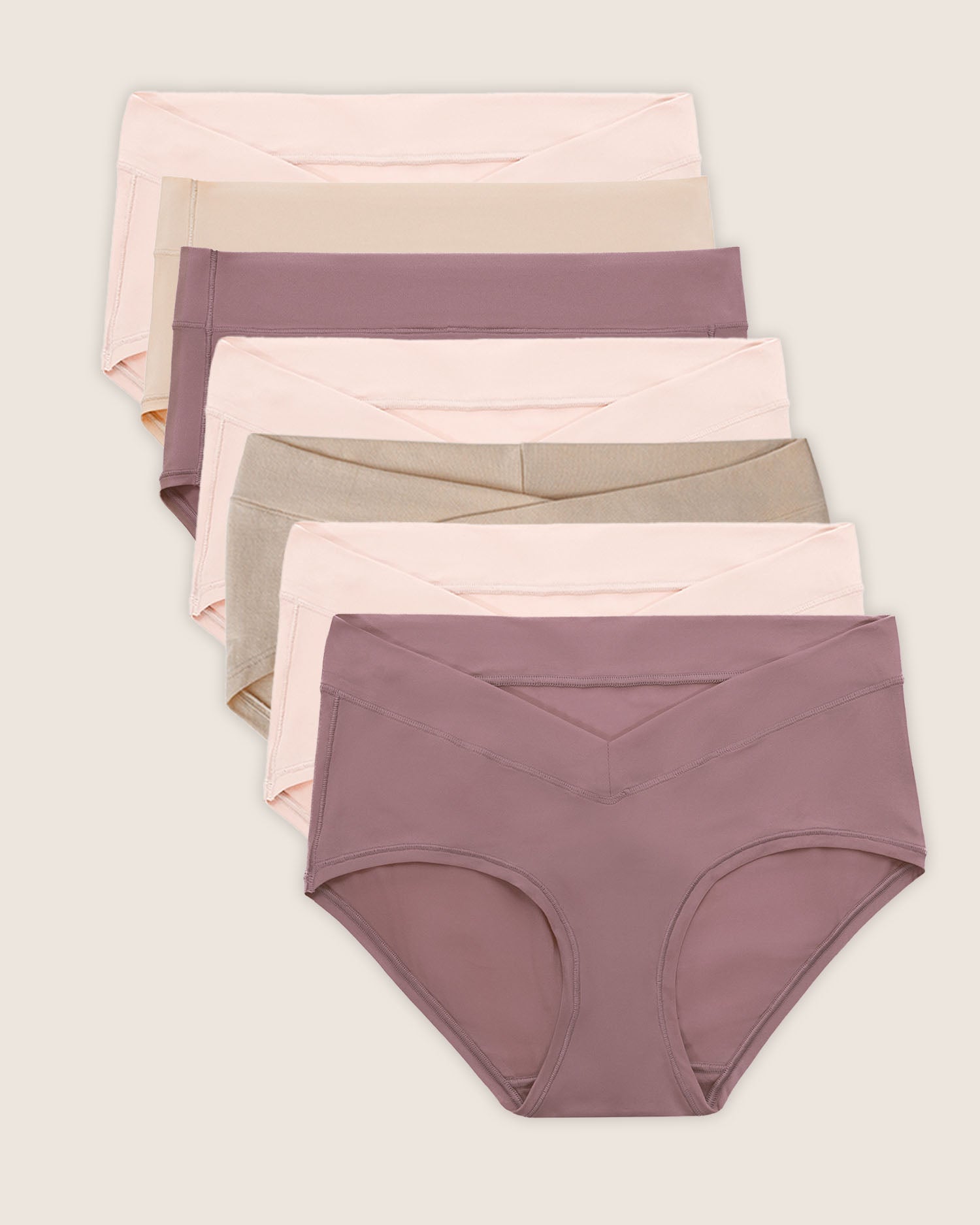 A collection of seven hipster style underwear in assorted colors beige, soft pink, and twilight