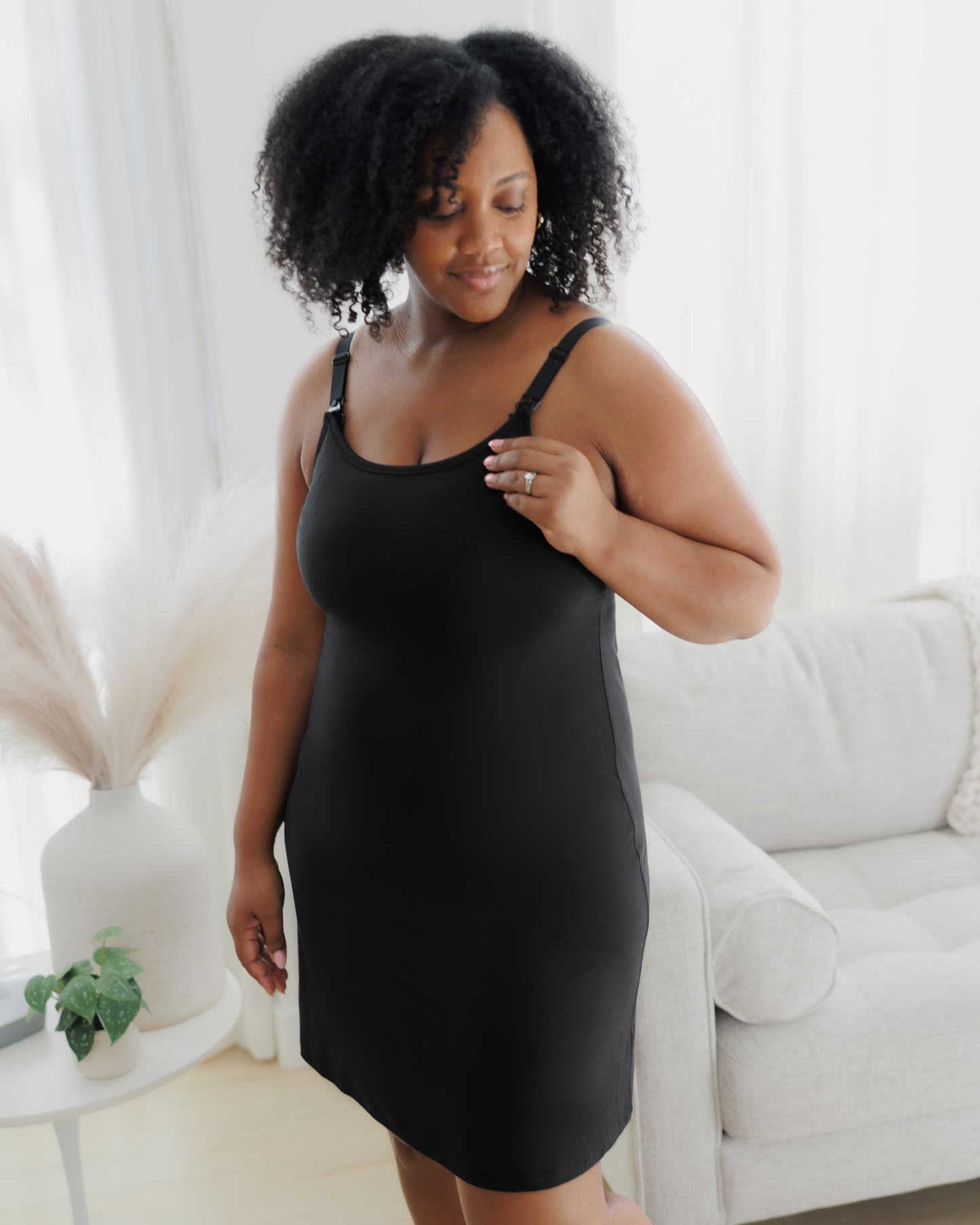 Side view of model wearing the Stella Hands-Free Pumping & Nursing Nightgown in Black