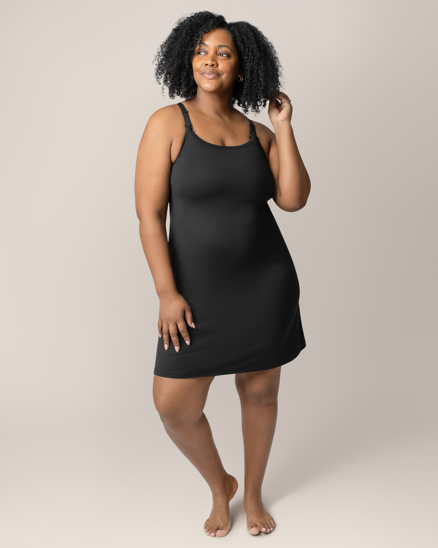 Front view of model wearing the Stella Hands-Free Pumping & Nursing Nightgown in Black @model_info:Roxanne is 5'8" and wearing a Large.