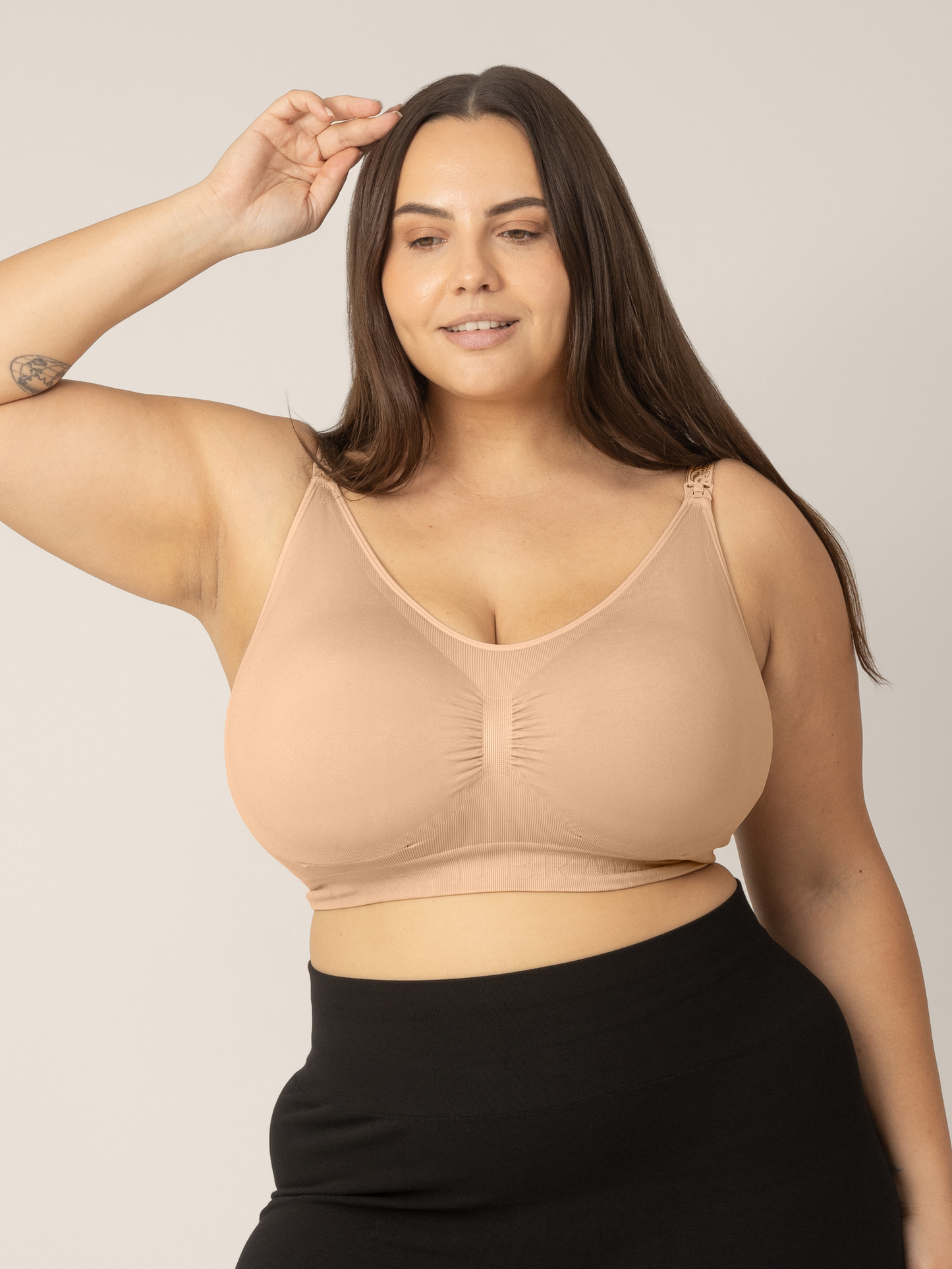 Front view of model wearing the Sublime Nursing Bra in beige showing the Super-busty size range. @model_info:Anna is wearing an X-Large Super Busty.