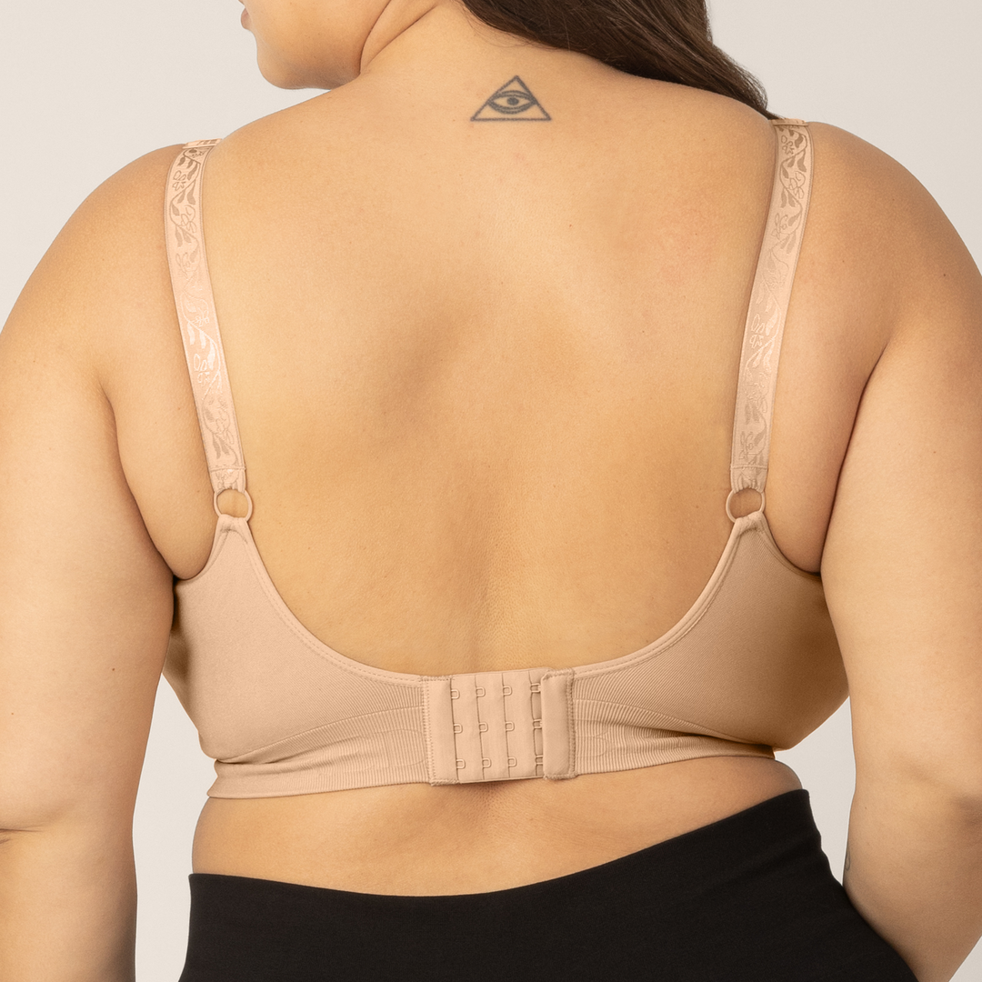 Zoomed in image of Super Busty model wearing the Sublime Nursing Bra in Beige. Back view.