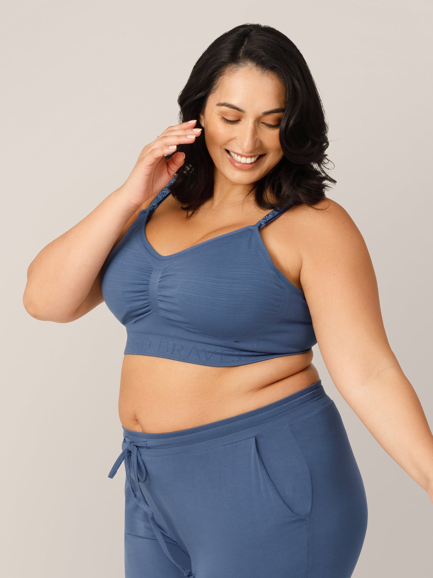 3/4 front view of model wearing the Sublime® Hands-Free Pumping & Nursing Bra in Slate Blue in a Busty fit.