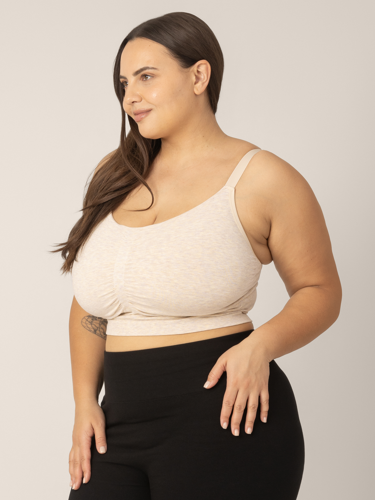Side view of Super busty model wearing the Sublime Hands-Free Pumping & Nursing Sleep and Lounge Bra in Oatmeal Heather. 