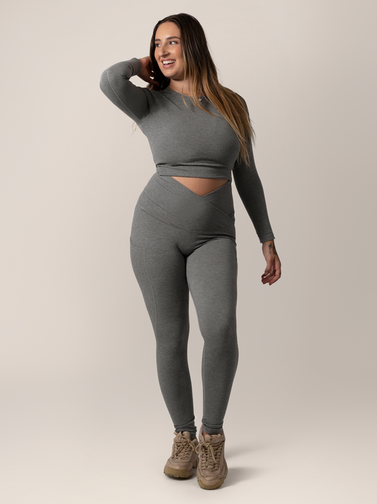 Front view of model wearing the Sublime®️ Bamboo Maternity & Postpartum Crossover Legging in Charcoal, paired with matching Sublime® Bamboo Maternity & Nursing Cropped Long Sleeve Top @model_info:Anna is 5'6" and wearing a Medium.