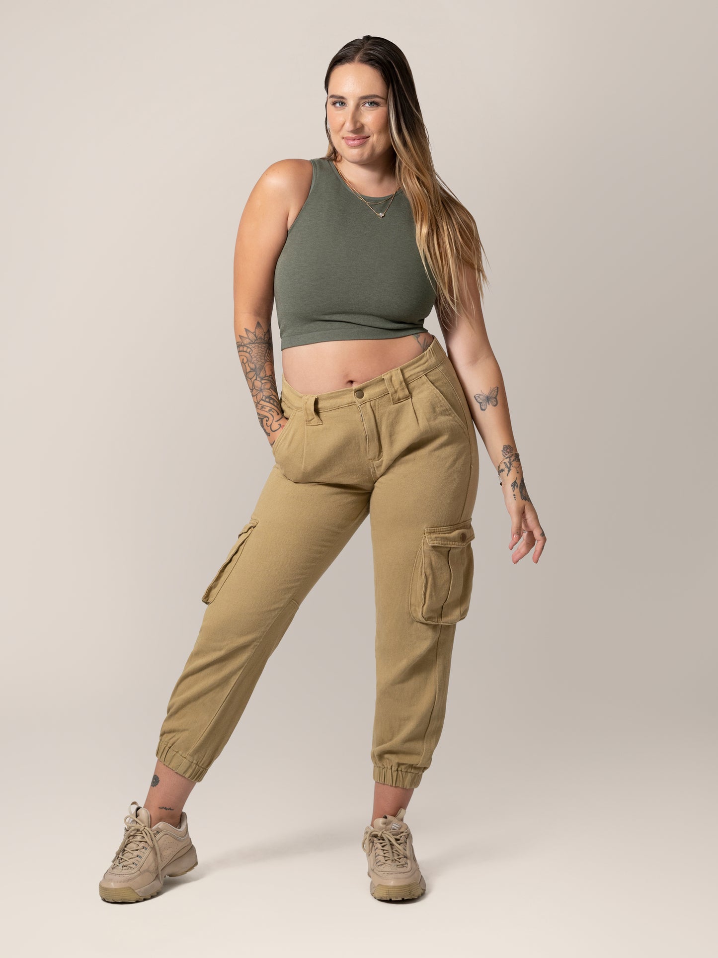 Front view of model wearing the Sublime® Bamboo Maternity & Nursing Longline Bra in Olive Heather, paired with tan cargo pants