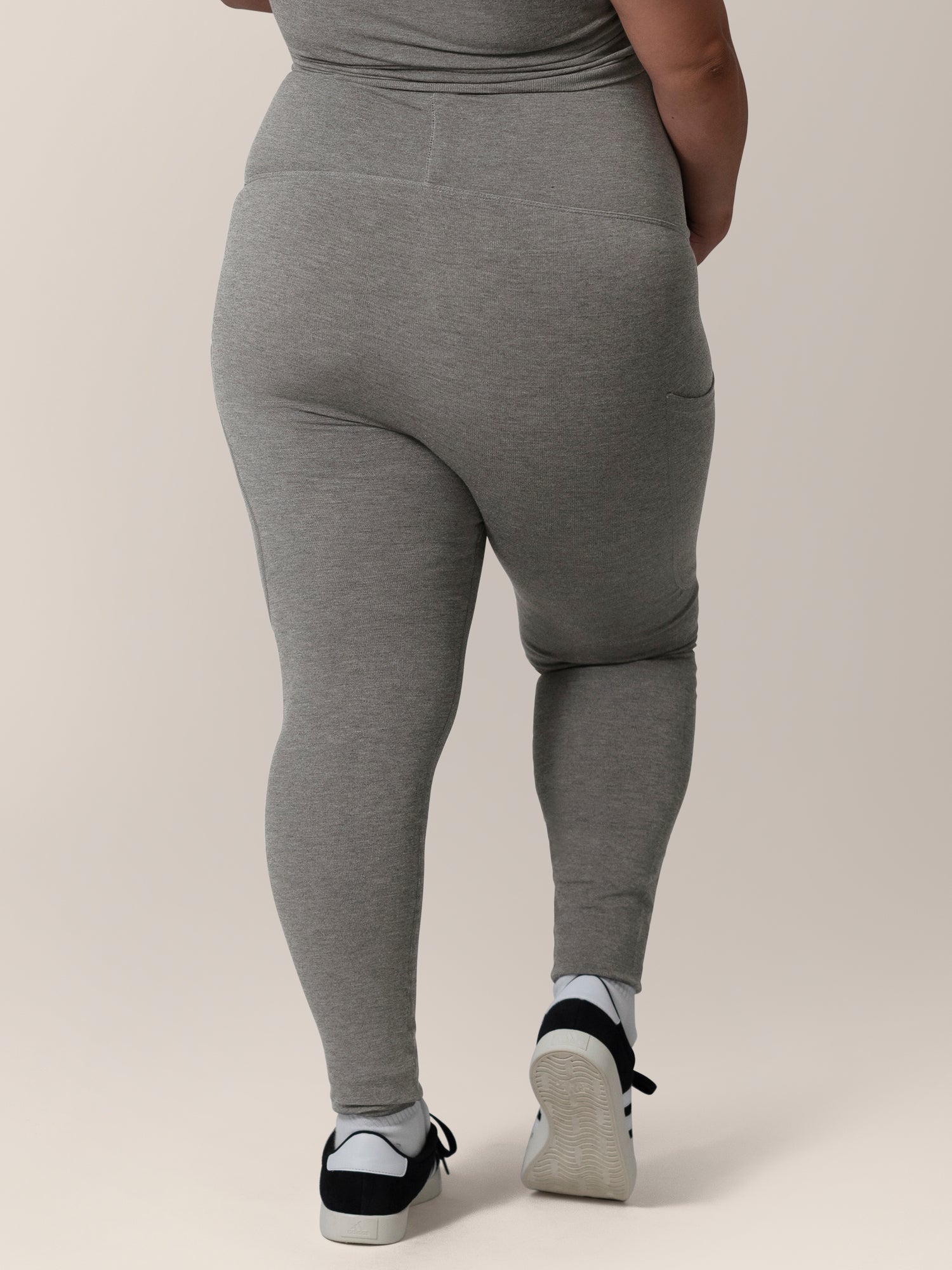 Back view close up of model wearing the Sublime®️ Bamboo Maternity & Postpartum Crossover Legging in Charcoal