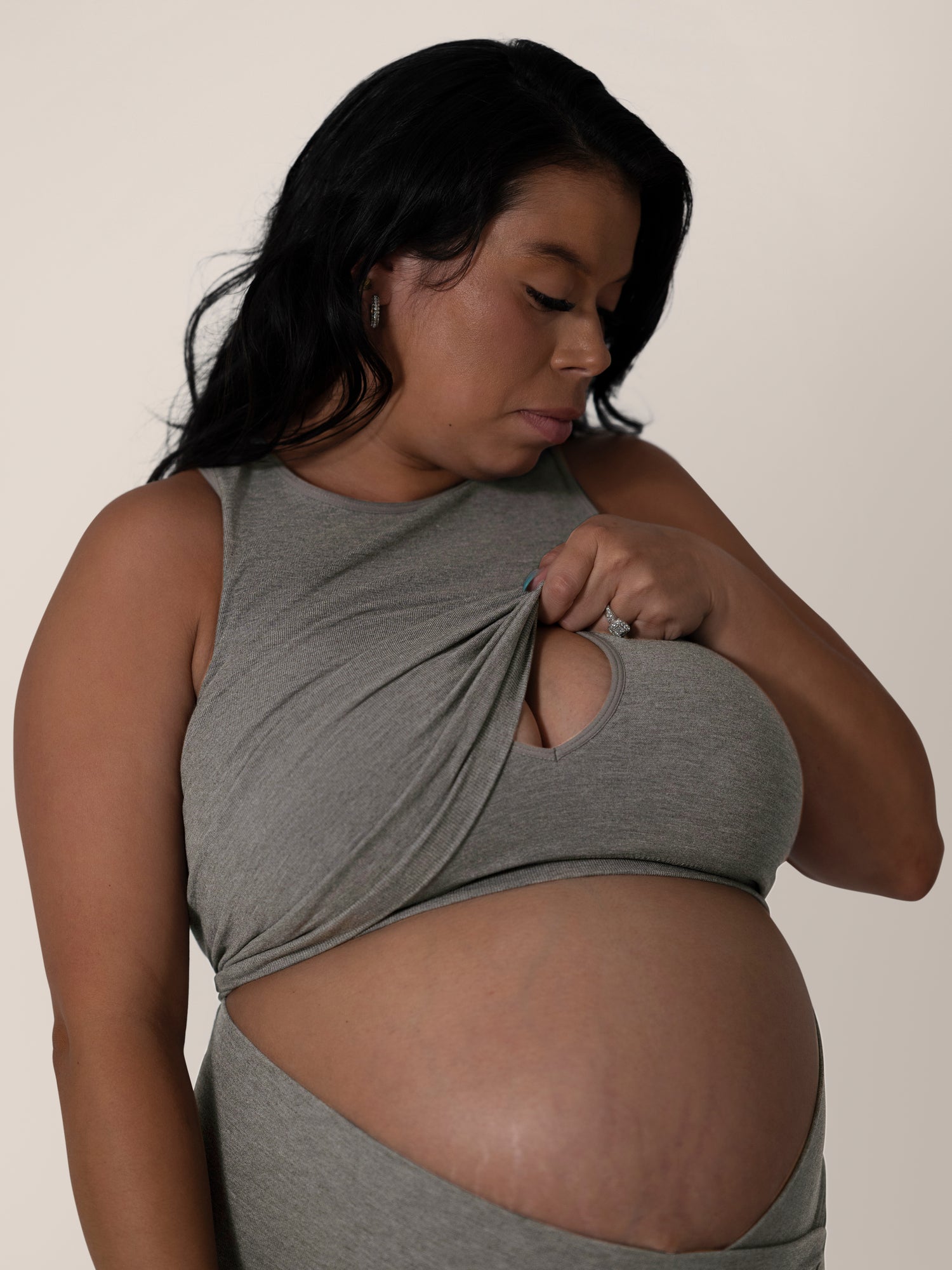 3/4 sview of model wearing the Sublime® Bamboo Maternity & Nursing Longline Bra in Charcoal , showing nursing access