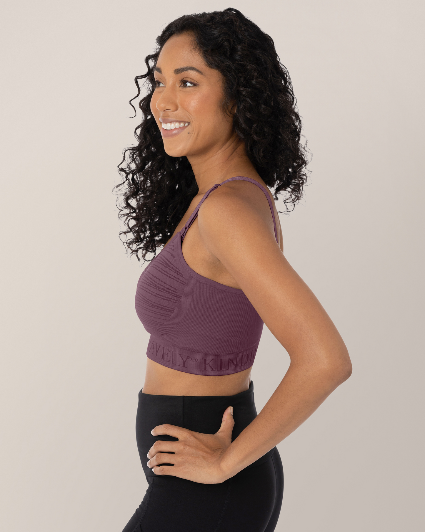 Profile view of model wearing the Sublime® Hands-Free Pumping & Nursing Bra in Burgundy Plum