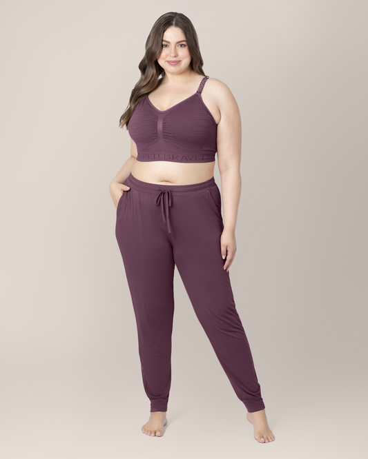 Front view of model wearing the Everyday Lounge Jogger in Burgundy Plum, paired with matching Sublime® Hands-Free Pumping & Nursing Bra@model_info:Bailey is 5'11" and wearing a 1X Long.