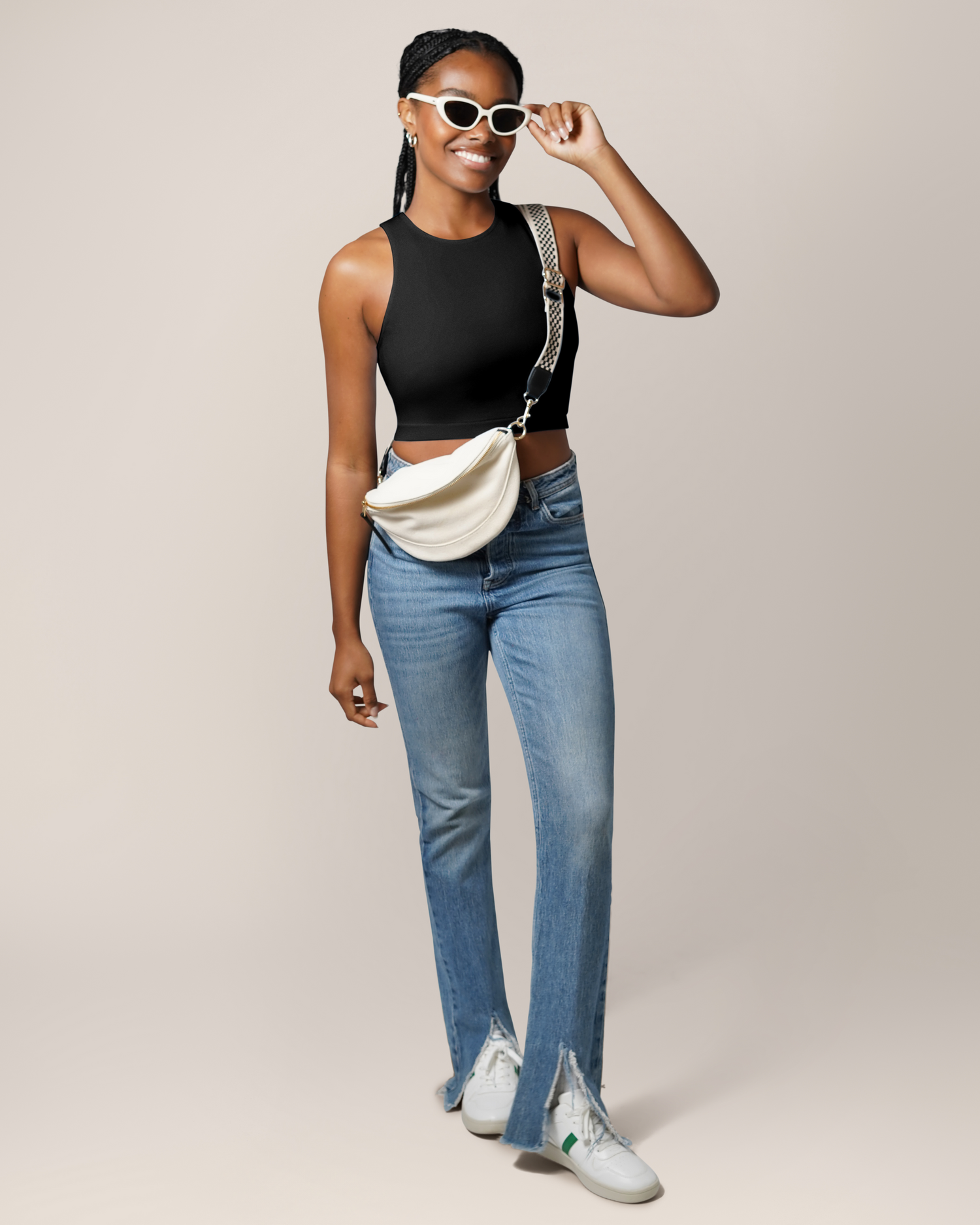 Front full body view of model wearing the Sublime® Bamboo Hands-Free Pumping Longline Bra Top in Black, paired with jeans, tennis shoes, and a crossbody bag