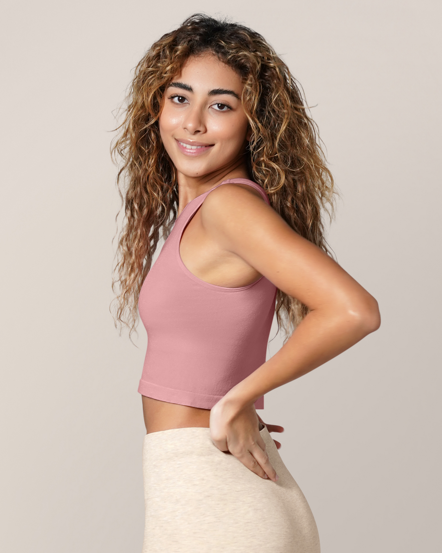 Side view of model wearing the Sublime® Bamboo Hands-Free Pumping Longline Bra Top in Light Mauve, paired with Sublime® Bamboo Maternity & Postpartum Bike Short in Oatmeal Heather