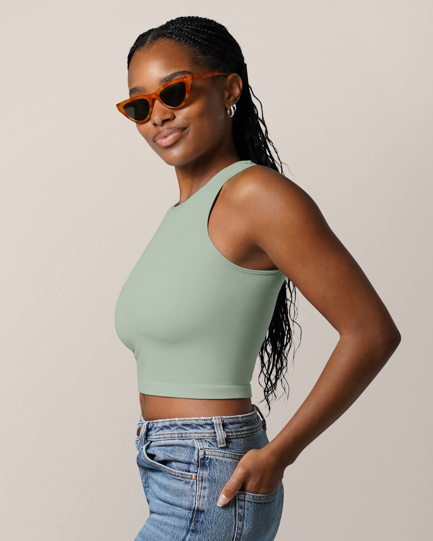 Side view of model wearing the Sublime® Bamboo Maternity & Nursing Longline Bra Top in Aqua Mist, paired with jeans 