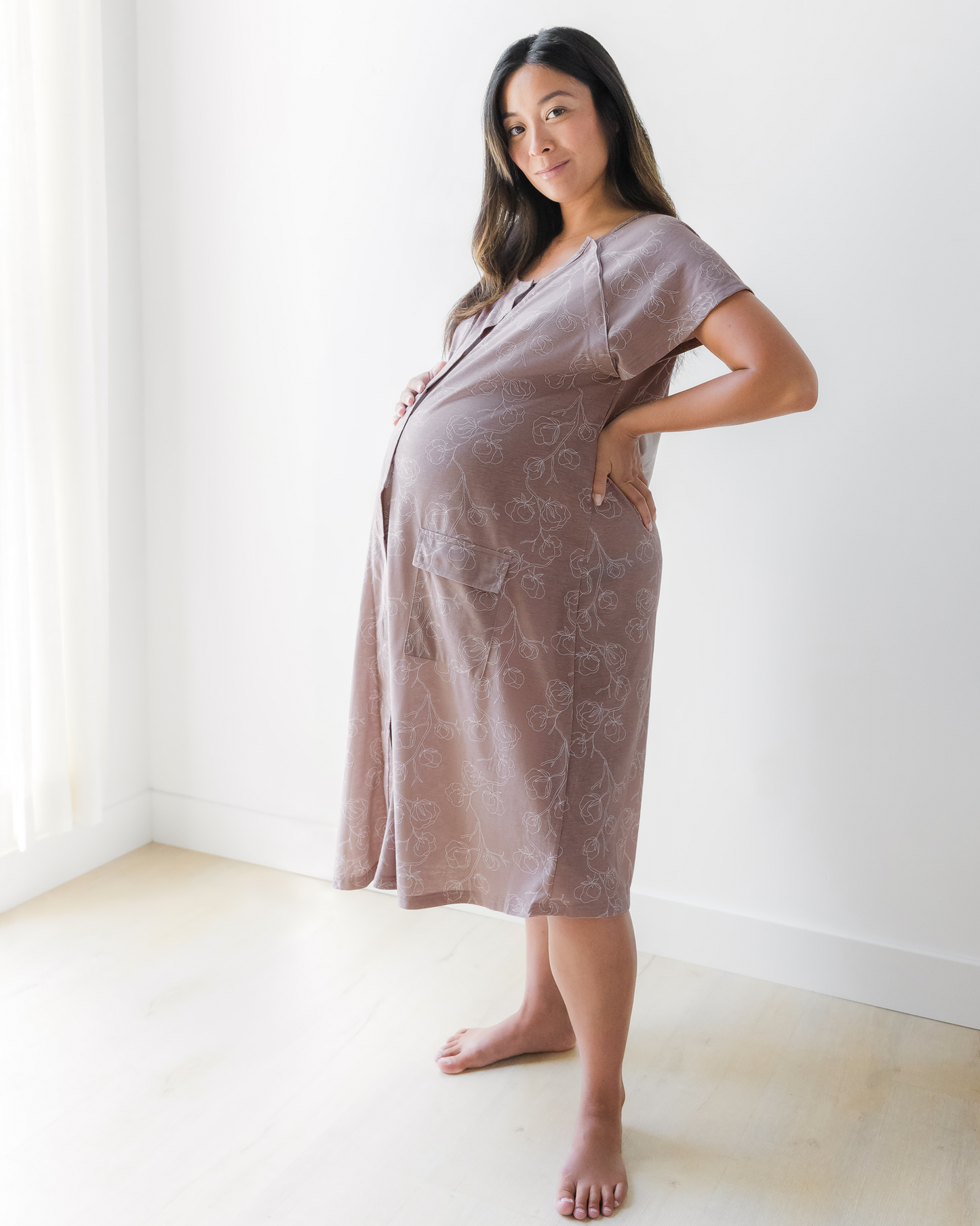 Pregnant model wearing the Universal Labor & Delivery Gown in Lilac Bloom